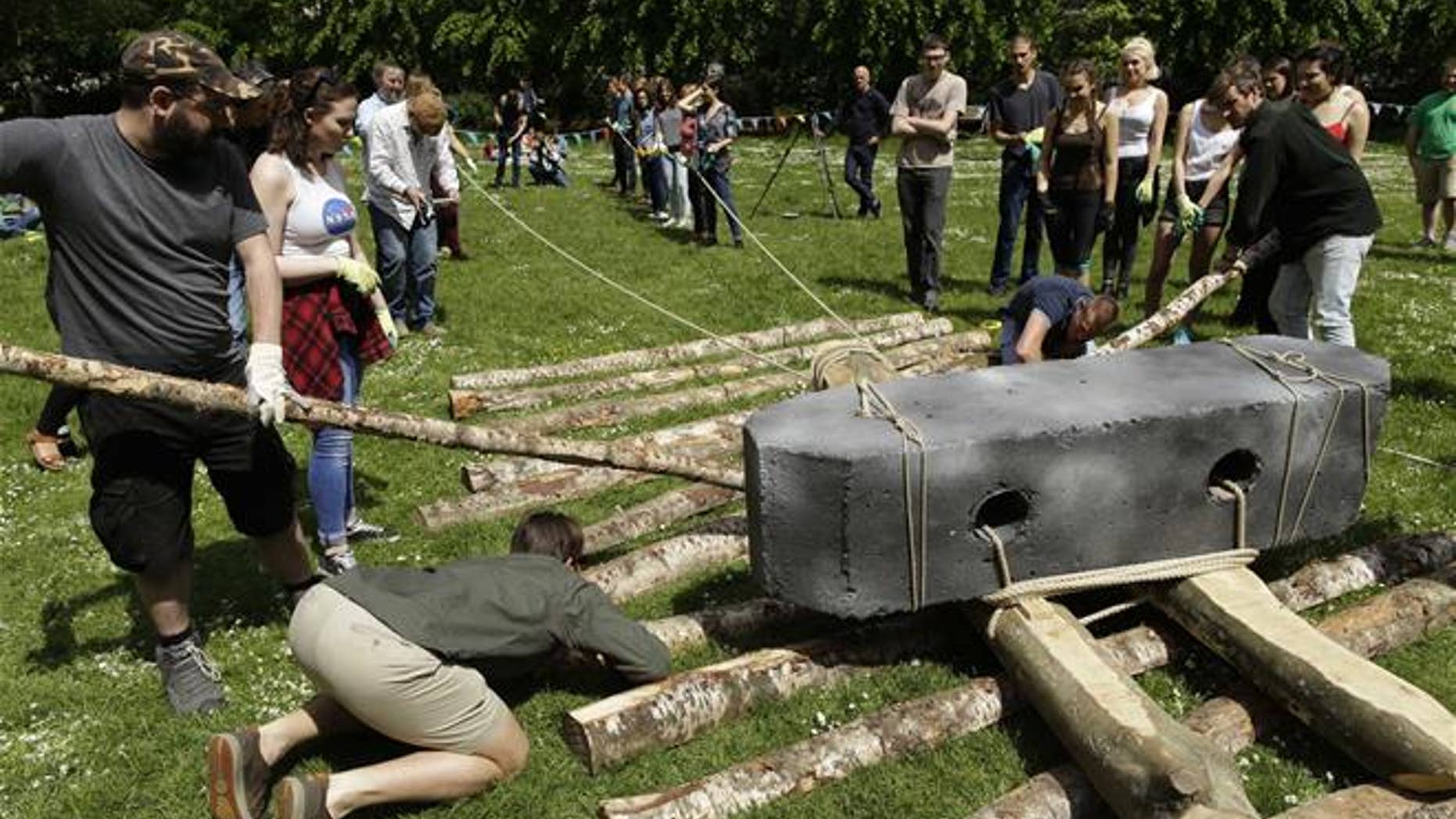 Researchers and volunteers make adjustments to their track.