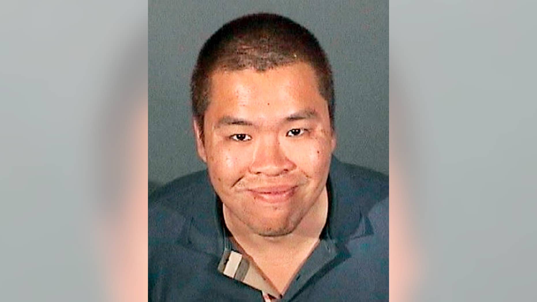 This Nov. 10, 2014 booking photo provided by the Arcadia, Calif., Police Department shows Kwan Chow. Chow, 31, of Monterey Park, Calif., was arrested Monday, Nov. 10, on suspicion of molesting a 10-year-old boy in the restroom of a Dave and Busters restaurant in Arcadia, after being chased through the restaurant by the alleged victim's mother and detained by security personnel. Chow is being held on $200,000 bail and is due in court on Thursday, Nov. 13. (AP Photo/Arcadia Police Department)