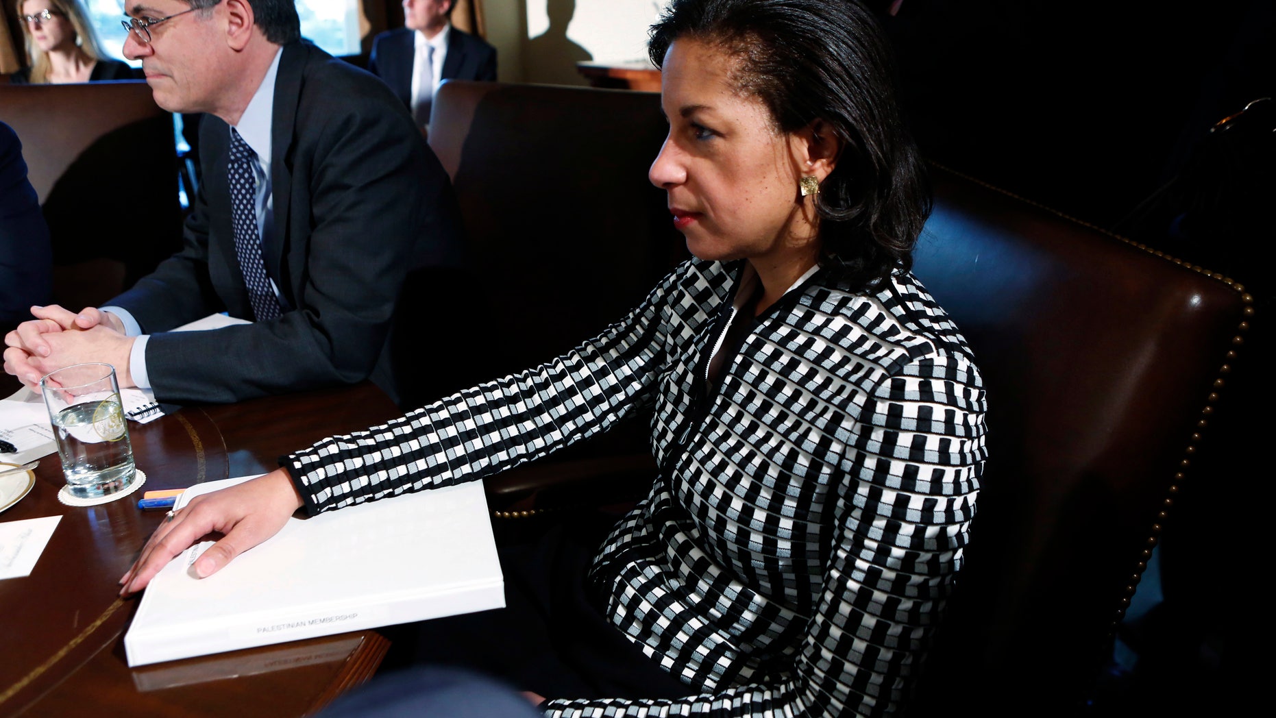 November 28, 2012: U.S. Ambassador to the United Nations Susan Rice listens to President Obama speak during a Cabinet meeting at the White House in Washington.