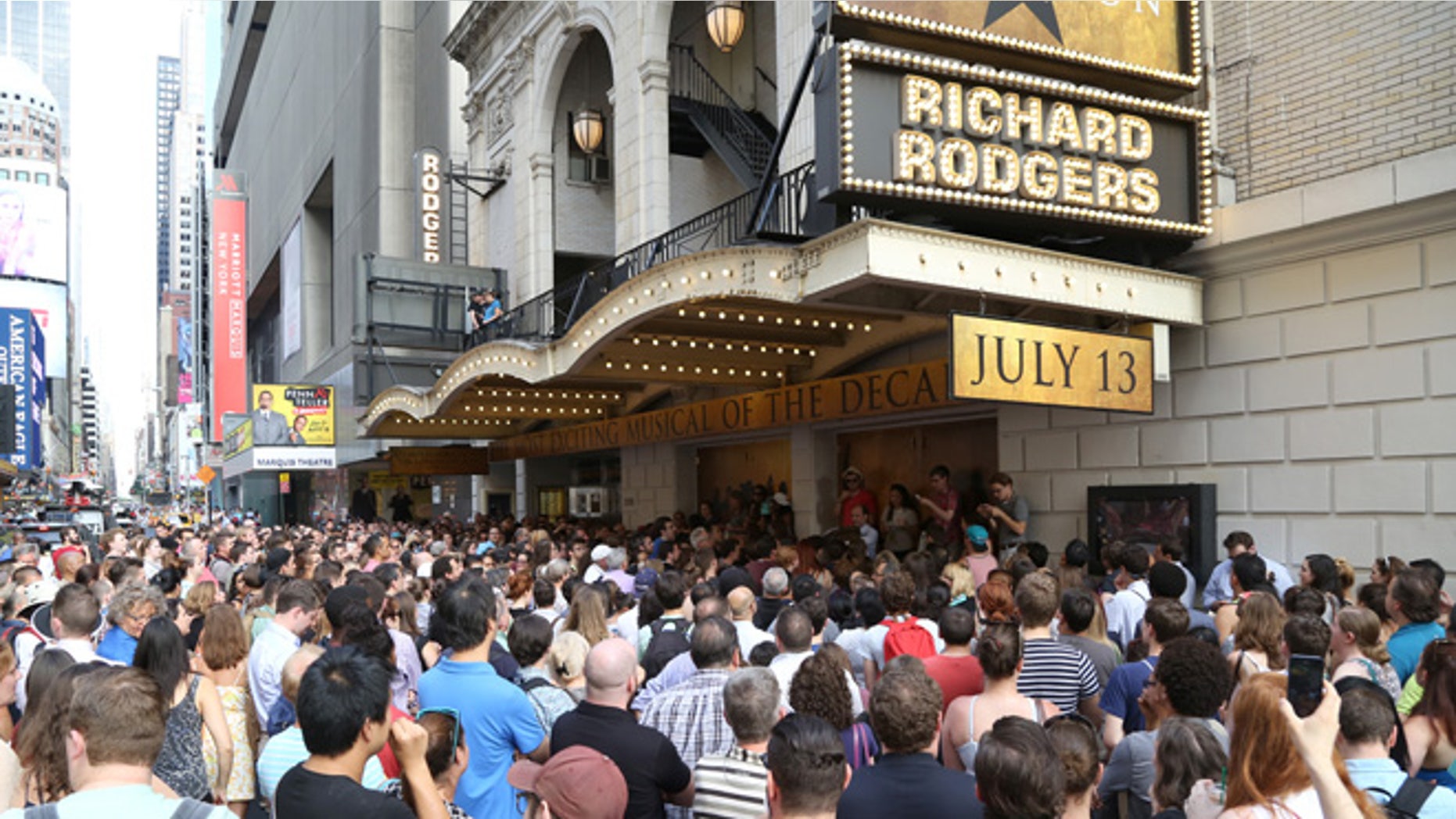 NEW YORK, NY - JULY 13: Huge crowds line up for the Lottery to win $10 front-row seats to see the new Broadway musical Hamilton. The musical about Founding Father Alexander Hamilton, whose face is depicted on the $10 bill, had their first preview at the Richard Rodgers Theatre on July 13, 2015 in New York City. (Photo by Walter McBride/Getty Images)
