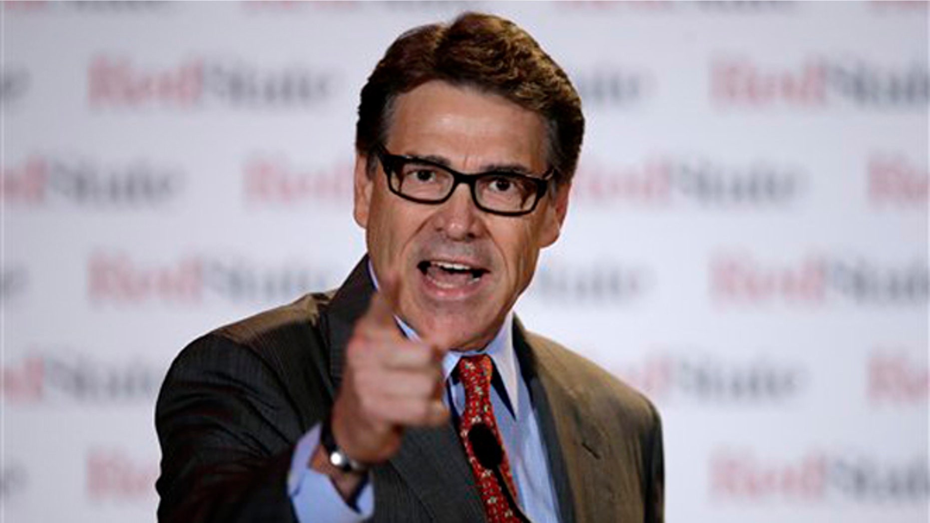 FILE - This Aug. 8, 2014, file photo shows Governor Rick Perry as he speaks at the 2014 Red State Gathering, in Fort Worth, Texas. Perry has been indicted for abuse of power after carrying out a threat to veto funding for state public corruption prosecutors. The Republican governor is accused of abusing his official powers by publicly promising to veto $7.5 million for the state public integrity unit at the Travis County District Attorney's office. He was indicted by an Austin grand jury Friday, Aug. 15. (AP Photo/Tony Gutierrez)
