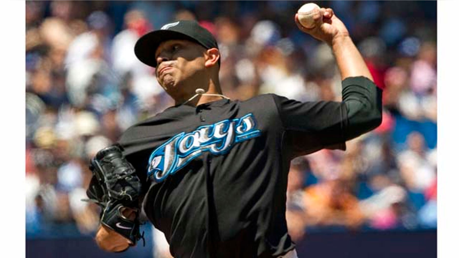 Toronto Blue Jays starting pitcher Ricky Romero throws against the New York Yankees during the first inning of a baseball game, Saturday, July 16, 2011, in Toronto. (AP Photo/The Canadian Press, Frank Gunn)