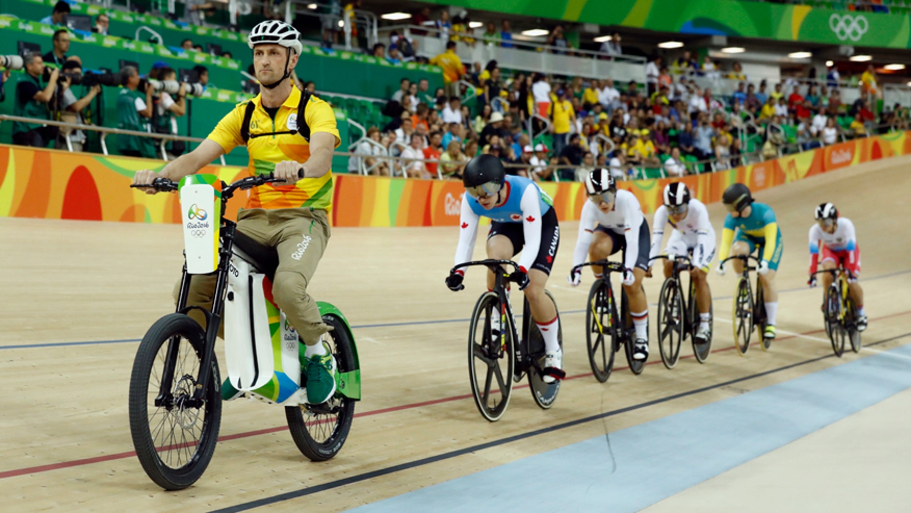 Cyclists compete in the Women's Keirin first round at the Rio Olympic Velodrome during the 2016 Summer Olympics in Rio de Janeiro, Brazil, Saturday, Aug. 13, 2016. (AP Photo/Patrick Semansky)
