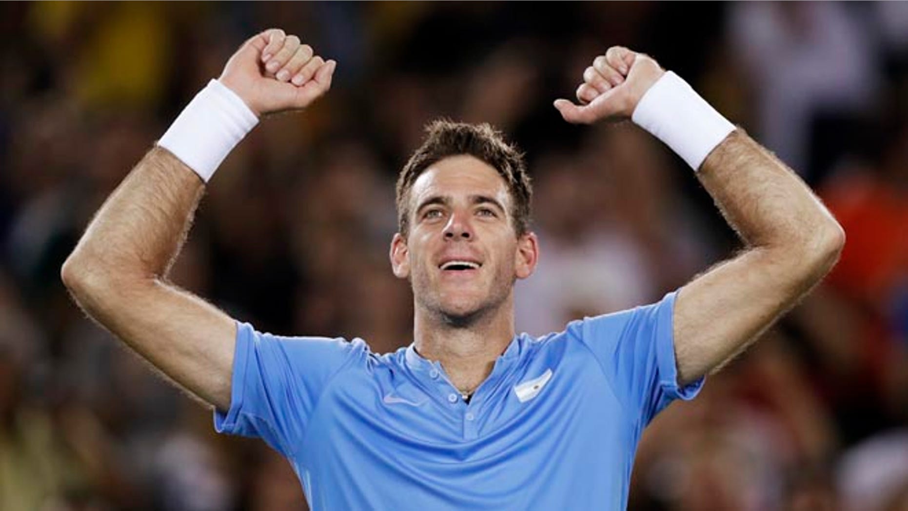 Juan Martin del Potro, of Argentina, raises his arms after defeating Novak Djokovic, of Serbia, at the 2016 Summer Olympics in Rio de Janeiro, Brazil, Sunday, Aug. 7, 2016. (AP Photo/Charles Krupa)