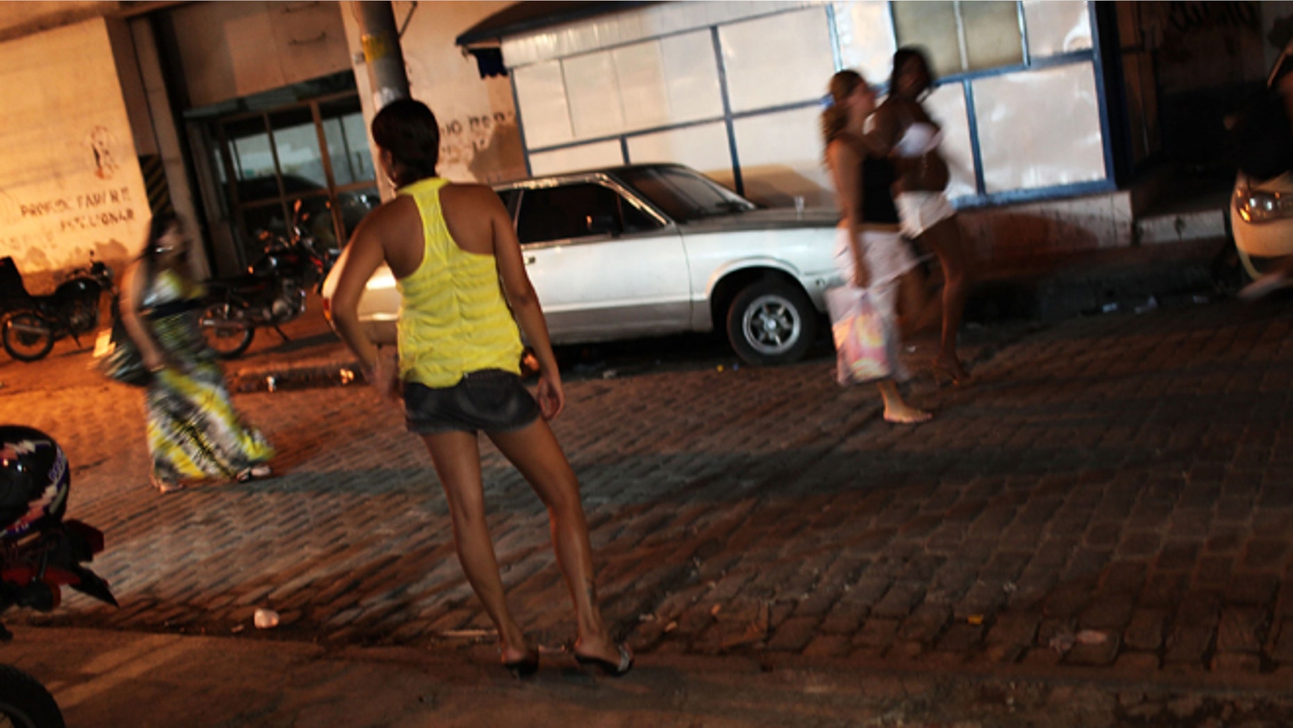 Female prostitutes walk the streets of the red light district, Vila Mimosa. (Photo by Spencer Platt/Getty Images)