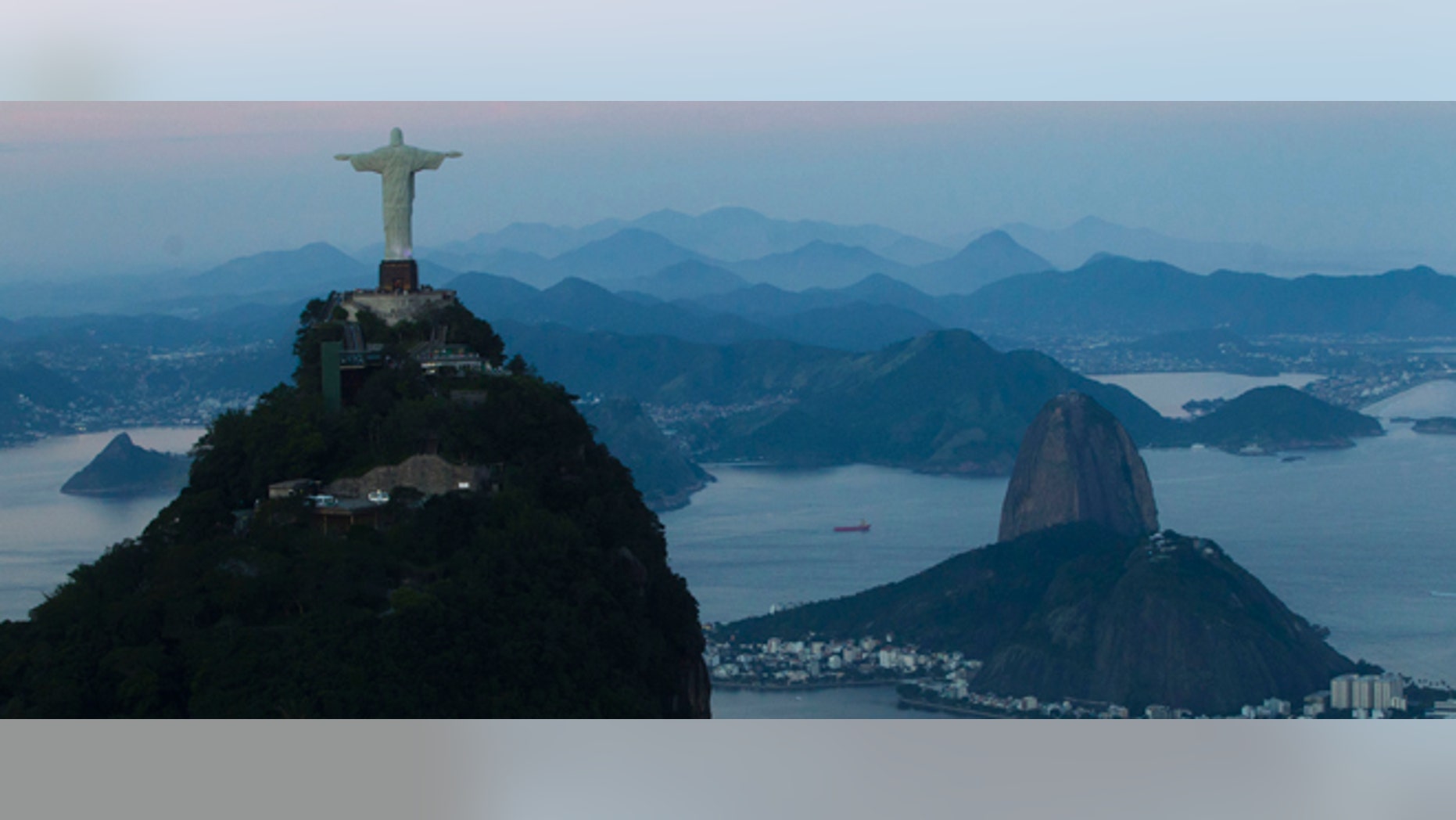 FILE - In this May 10, 2012 file photo, the Christ the Redeemer statue stands back dropped by Sugar Loaf mountain, right, as the sun sets in Rio de Janeiro, Brazil. The Olympic flame goes out in London on Sunday, Aug. 12, 2012, and all eyes turn to Rio, which in 2016 will become the first South American city to host the Games. (AP Photo/Felipe Dana, File)
