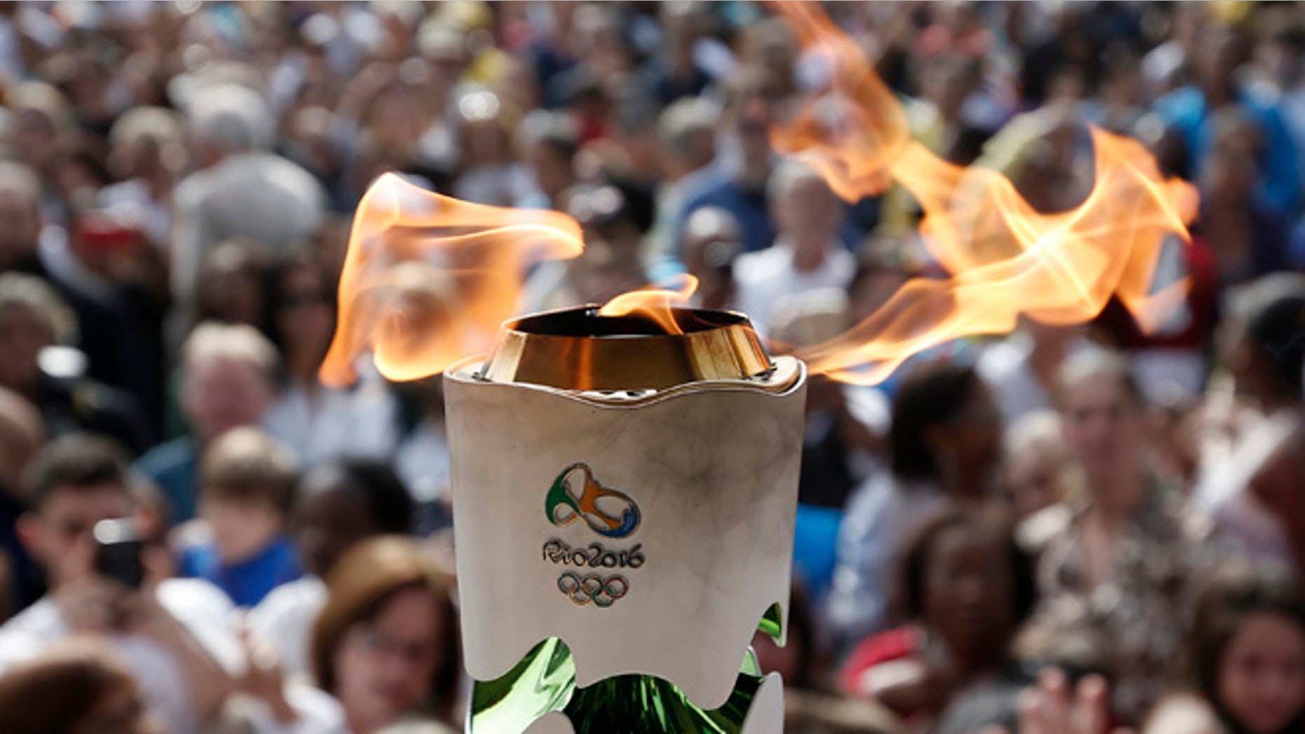 LEOPOLDINA, BRAZIL - MAY 16: Detail shot of Olympic Torch during day 14 of the Olympic Flame torch relay on May 16 , 2016 in Leopoldina, Brazil. The Olympic torch will pass through 329 cities from all states from the north to the south of Brazil, until arriving in Rio de Janeiro on August 5, to lit the cauldron.