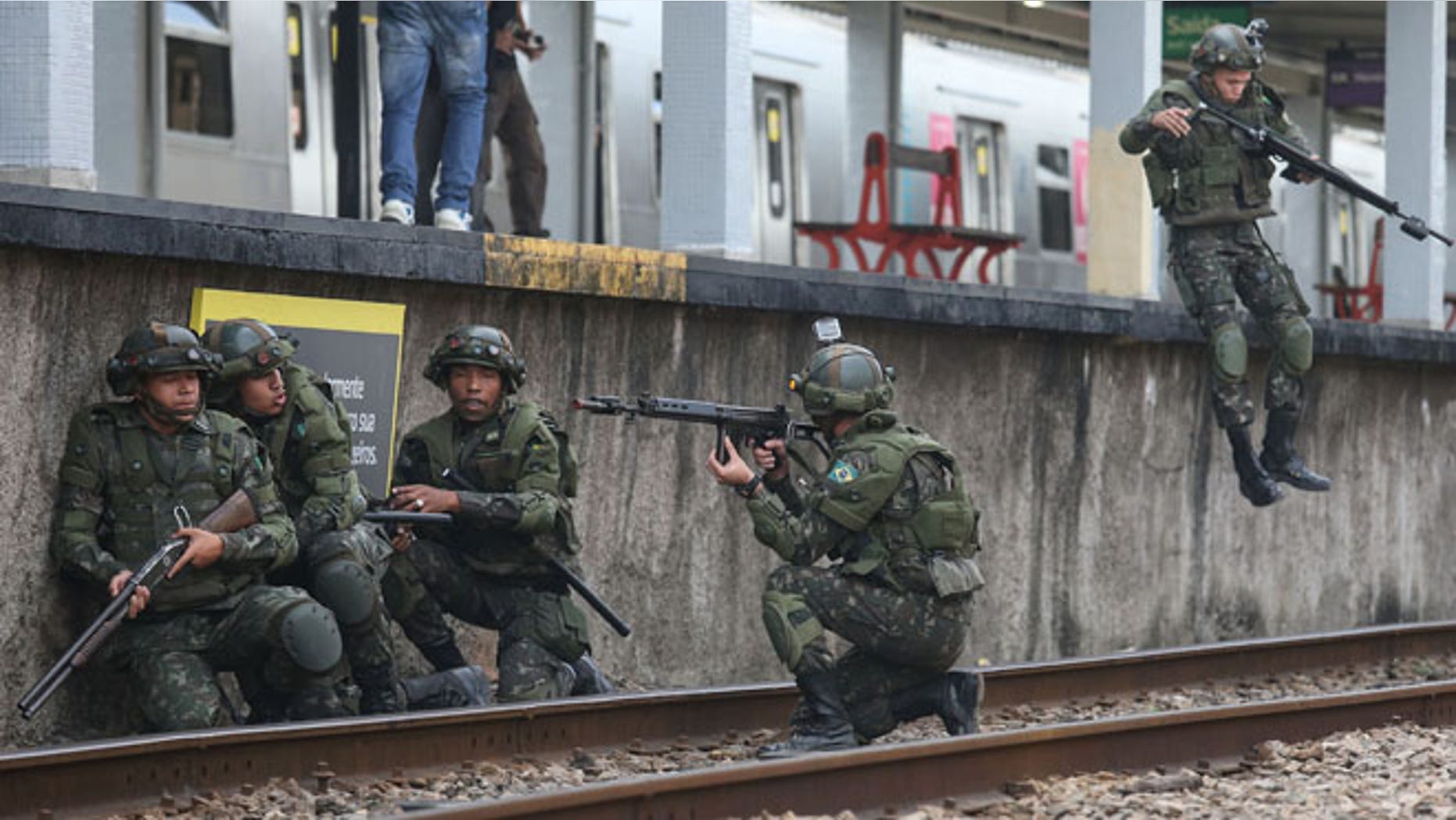 Brazilian soldiers conduct a counterterrorism drill simulating an attack at the Deodoro train station on July 16, 2016 in Rio de Janeiro, Brazil. Brazil announced yesterday it was bolstering security for the Rio 2016 Olympic Games following the truck attack in Nice, France, which killed at least 84 people. Deodoro is one of four main venue locations for the upcoming Olympics which begin August 5. (Photo by Mario Tama/Getty Images)