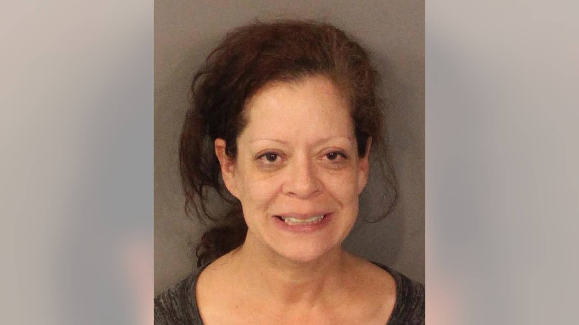 This undated photo released by the Placer County Sheriff's office shows Deirdre Orozco, 50, of Santa Clara, Calif. Orozco made her first court appearance Tuesday, Dec. 23, 2014, after a road rage incident was captured in a dramatic cellphone video that showed a vehicle forcing two motorists off a Northern California highway. She was charged with two counts of assault with a deadly weapon, two counts of false imprisonment, unlawful use of a badge, reckless driving and resisting arrest. (AP Photo/Placer County Sheriff's Office)