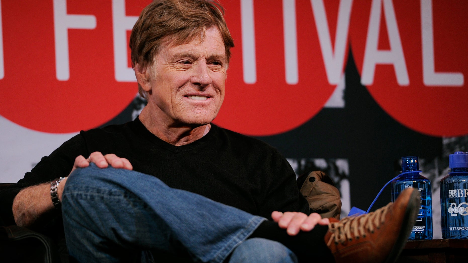 Robert Redford, founder and president of the Sundance Institute, looks on from the stage during the opening news conference of the 2014 Sundance Film Festival on Thursday, Jan. 16, 2014, in Park City, Utah.