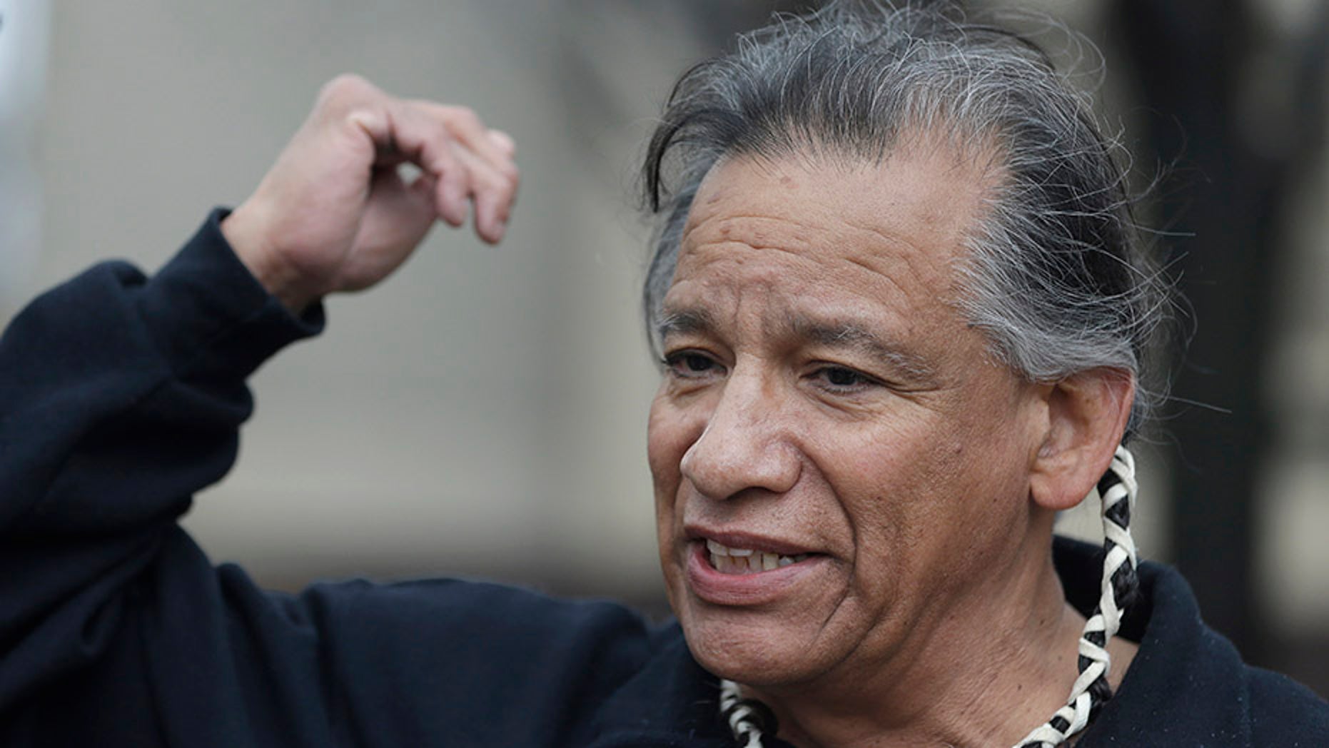 Robert Roche, an Apache, leads a protest against the Indians' Chief Wahoo mascot in April 2014.
