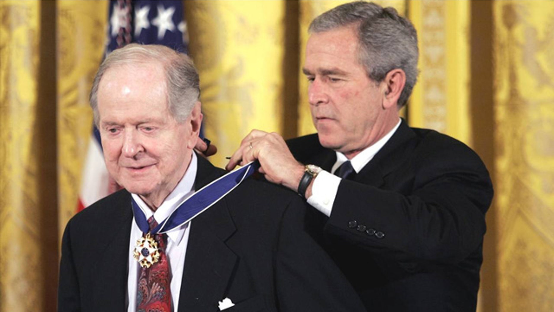 Nov. 9, 2005: Historian Robert Conquest receives the Presidential Medal of Freedom from President George W. Bush at the White House (Evan Vucci/AP)