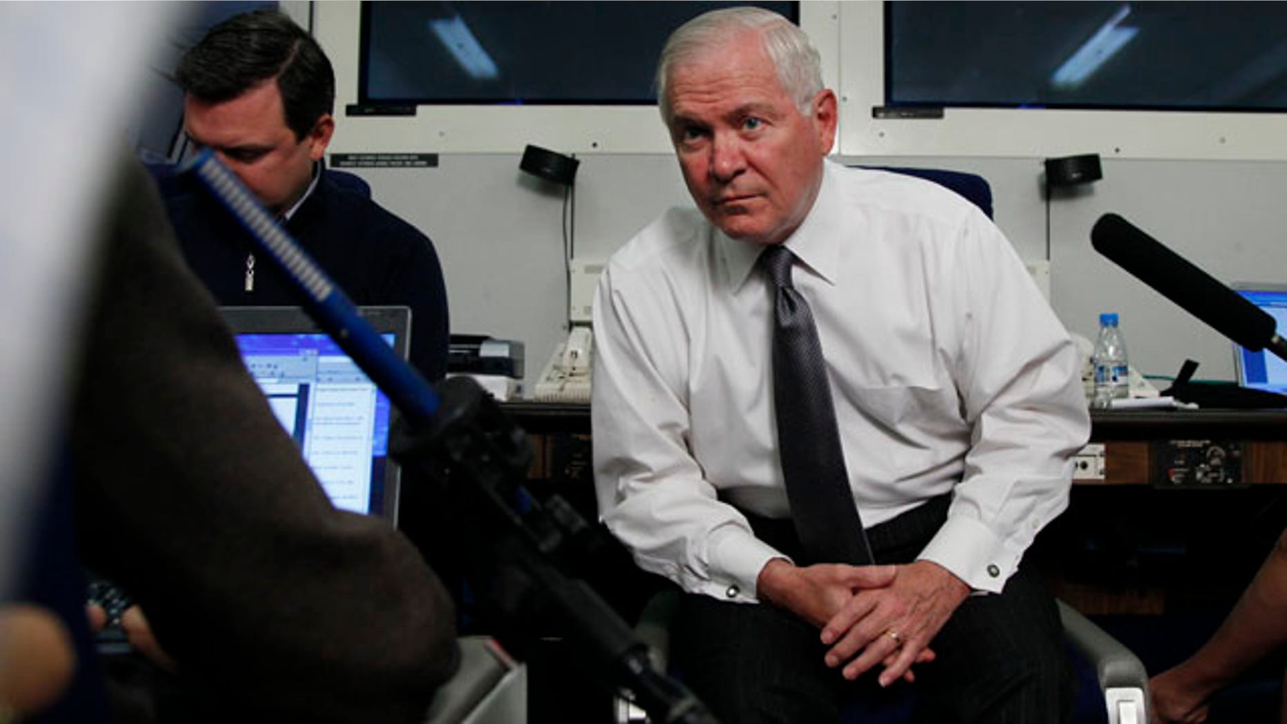 June 3: Defense Secretary Robert Gates pauses to listen to media questions aboard a U.S. Military aircraft en route to Singapore. (AP)
