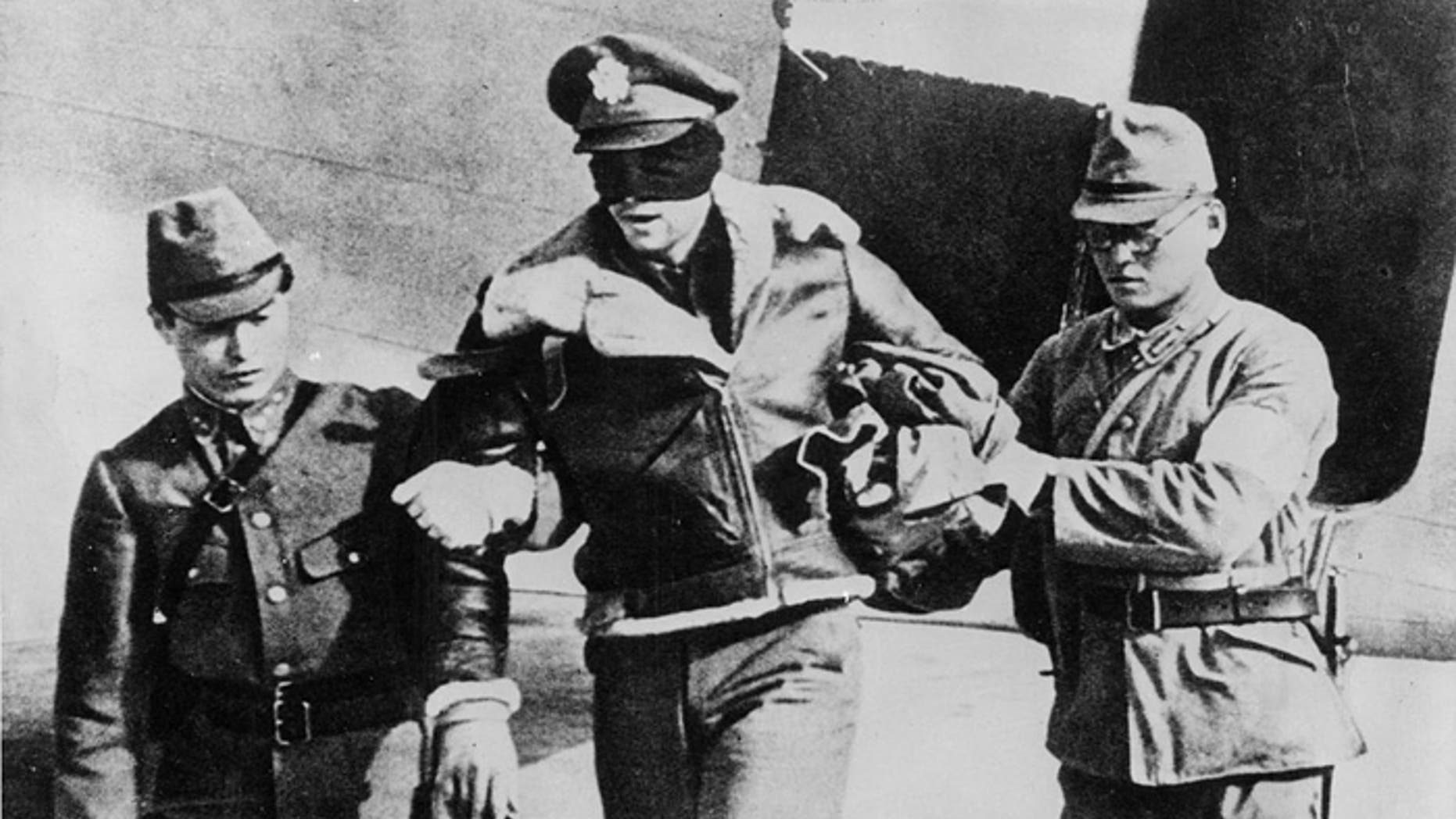 Lt. Col. Robert Hite, shown here being led blindfolded by his captors, was held for 40 months.
