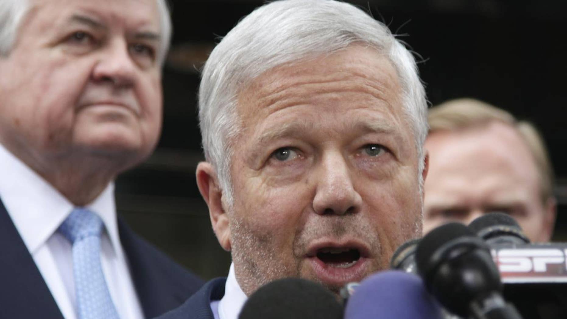 New England Patriots owner Robert Kraft, center, speaks during a news conference at the NFL Players Association in Washington, Monday, July 25, 2011, after the NFL Players Association executive board and 32 team reps voted unanimously Monday to approve the terms of a deal with owners to the end the 4½-month lockout. (AP Photo/Carolyn Kaster)