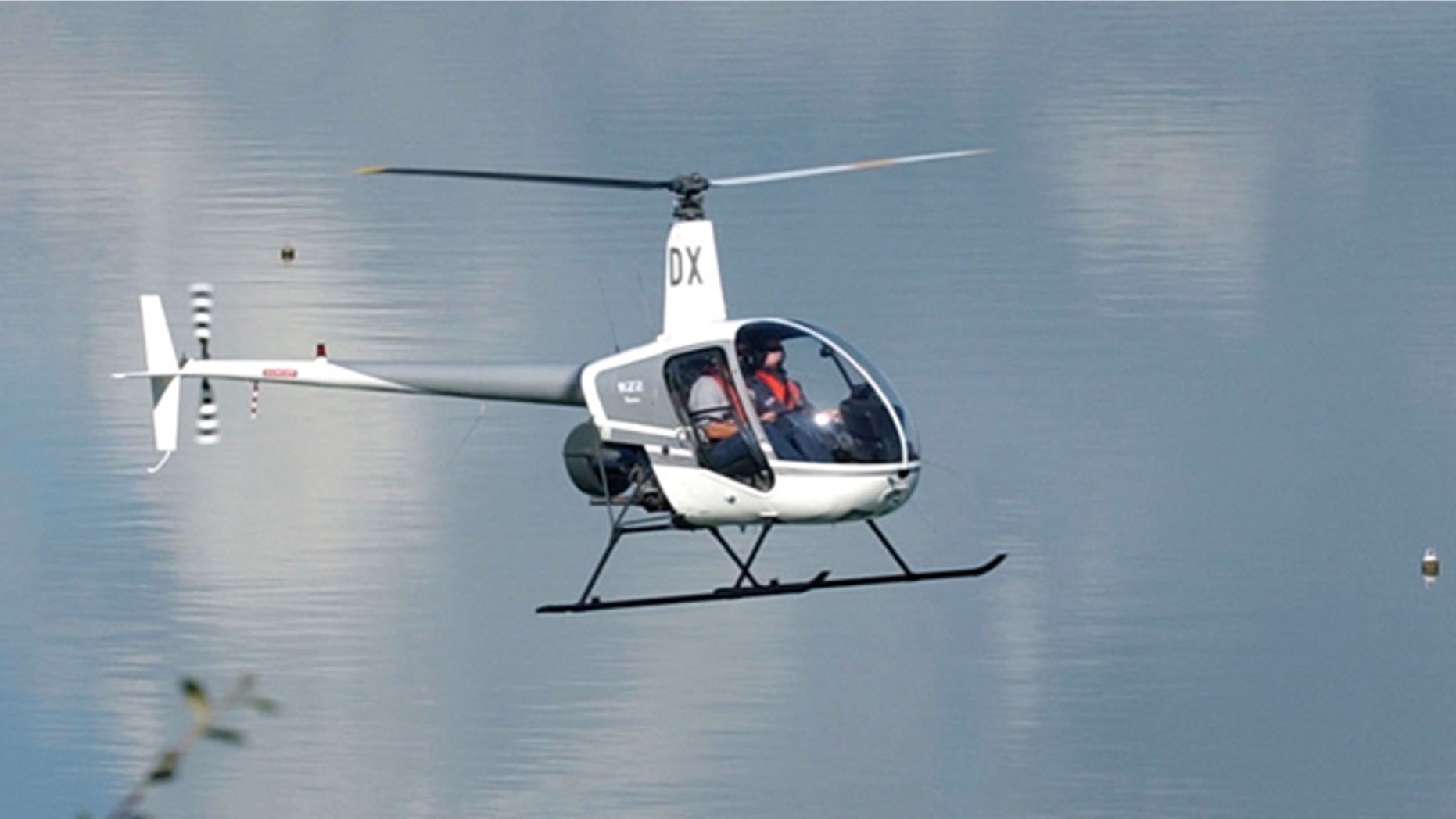 AUCKLAND, NEW ZEALAND - APRIL 17: A Robinson R22 helicopter does a test flight around Catalina Bay on Auckland's Waitemata Harbour, Wednesday. (Photo by Dean Purcell/Getty Images)