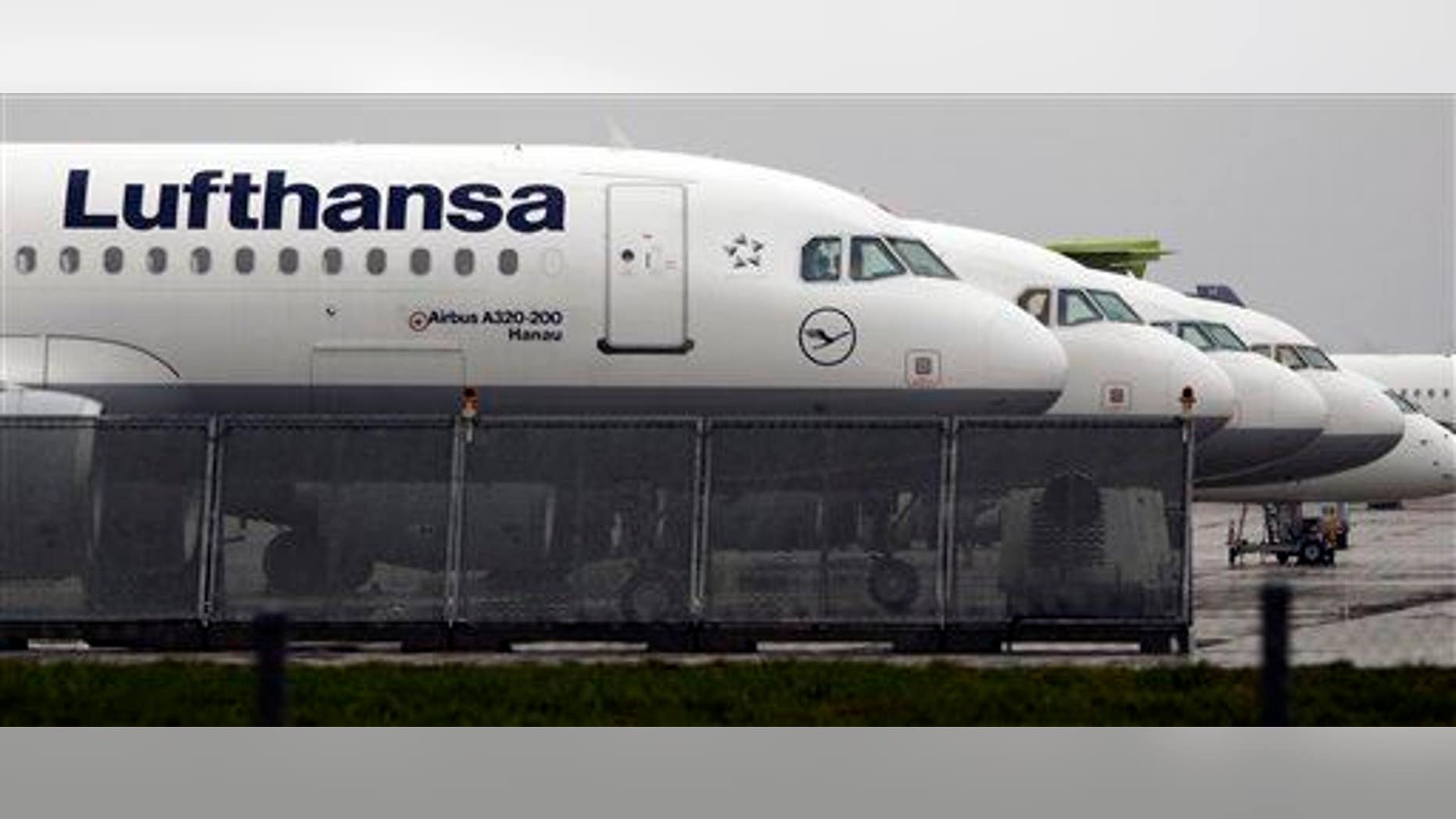 Lufthansa planes are parked at the airport at the airport in Munich, southern Germany.