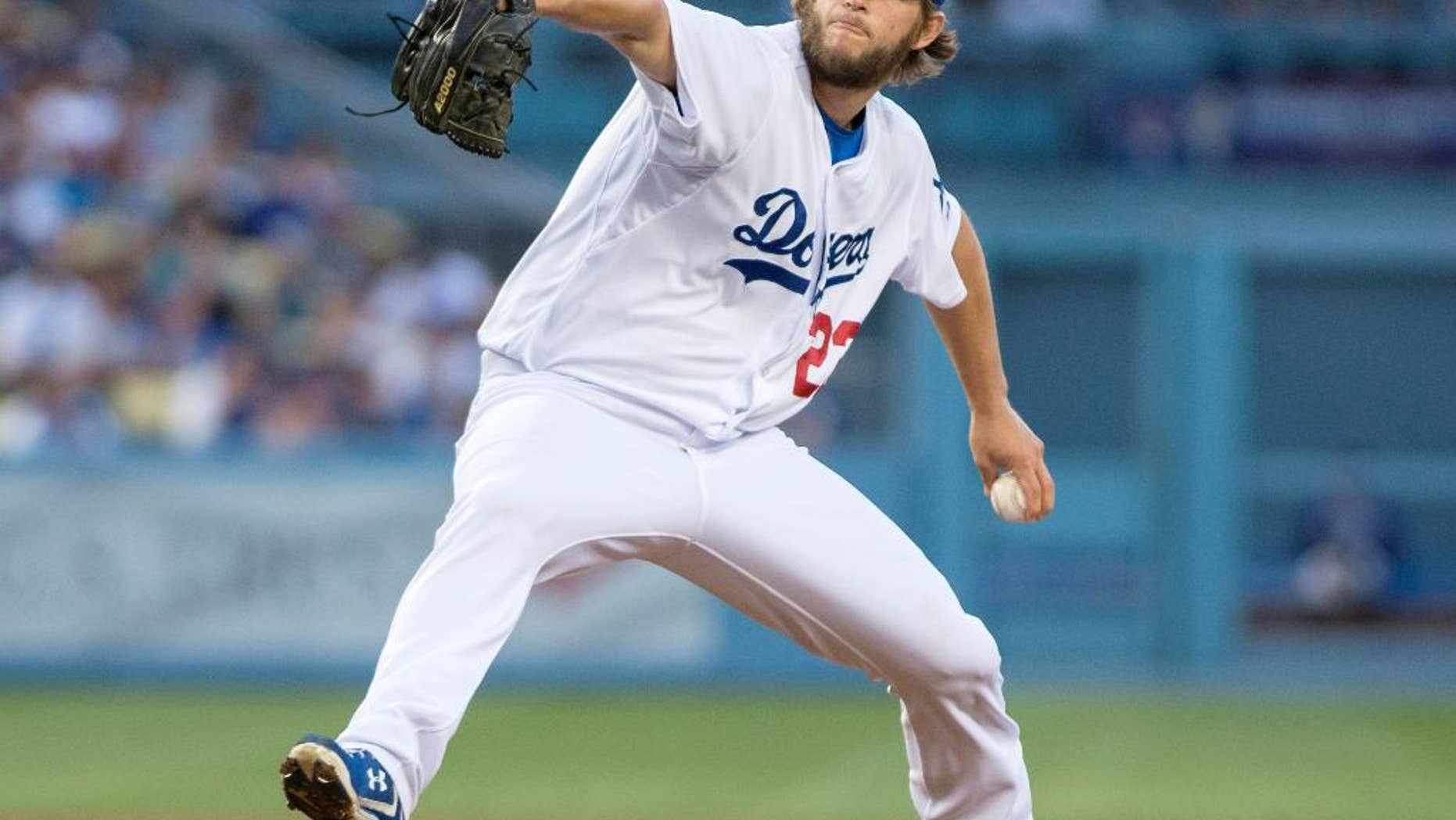 The Dodgers' Clayton Kershaw delivers a pitch during a game against the Rockies at Dodger Stadium on Wednesday June 18, 2014. Kershaw pitched his first no-hitter Wednesday night, striking out a career-high 15 and allowing his only baserunner on a throwing error by shortstop Hanley Ramirez in the Los Angeles Dodgers' 8-0 victory over the Colorado Rockies. (AP Photo/The Orange County Register, Kyusung Gong)