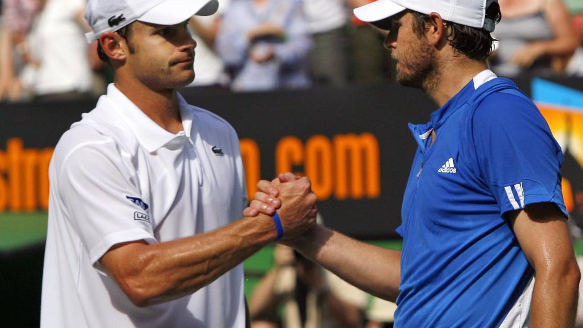 FILE- In this Jan. 23, 2007, file photo, Andy Roddick, left, of the United States, is congratulated by compatriot Mardy Fish after their quarterfinal match at the Australian Open tennis tournament in Melbourne, Australia. The pair will play doubles together at the BB&T Atlanta Open next month, and Fish is also going to attempt another comeback in singles. (AP Photo/Andrew Brownbill, File)
