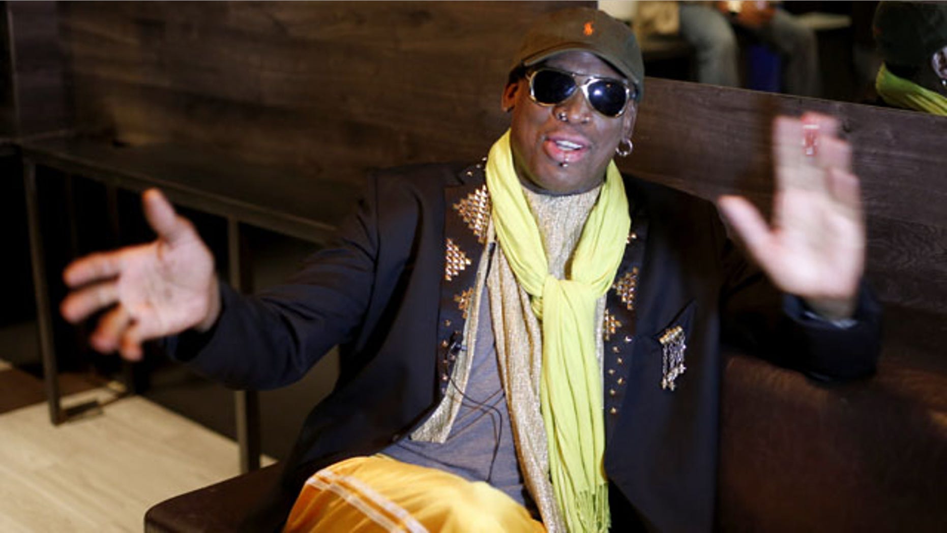 November 21, 2013: Dennis Rodman gestures during an interview after a promotional event to pitch a vodka brand in Chicago. (AP Photo)