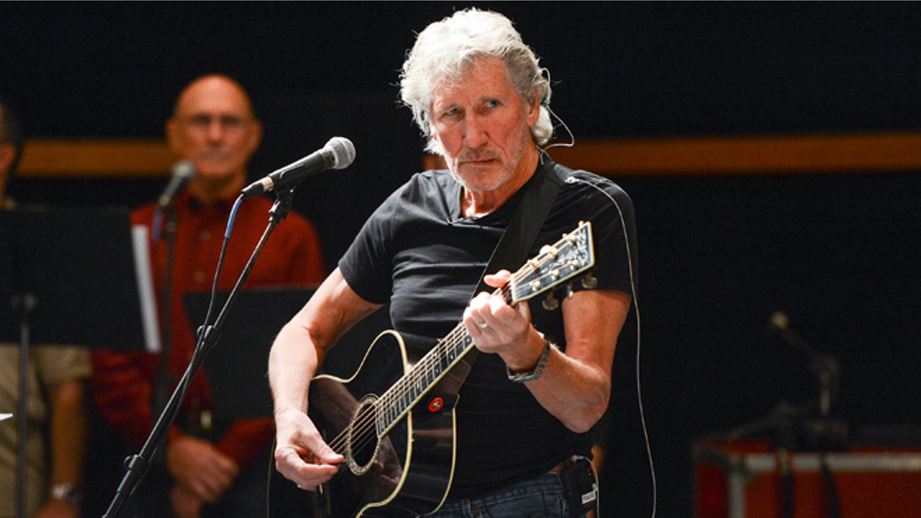 FILE - In this Nov. 4, 2013 file photo, musician Roger Waters and his band hold rehearsals with members of the Wounded Warriors Project, in New York. In the first of three concerts this week in Mexico City, on Wednesday, Sept. 28, 2016, Waters blasted Donald Trump and called on Mexicos President Enrique Peña Nieto to "listen to your people" and to answer for the thousands of missing persons in the country since the beginning of his mandate. (Photo by Evan Agostini/Invision/AP, File)