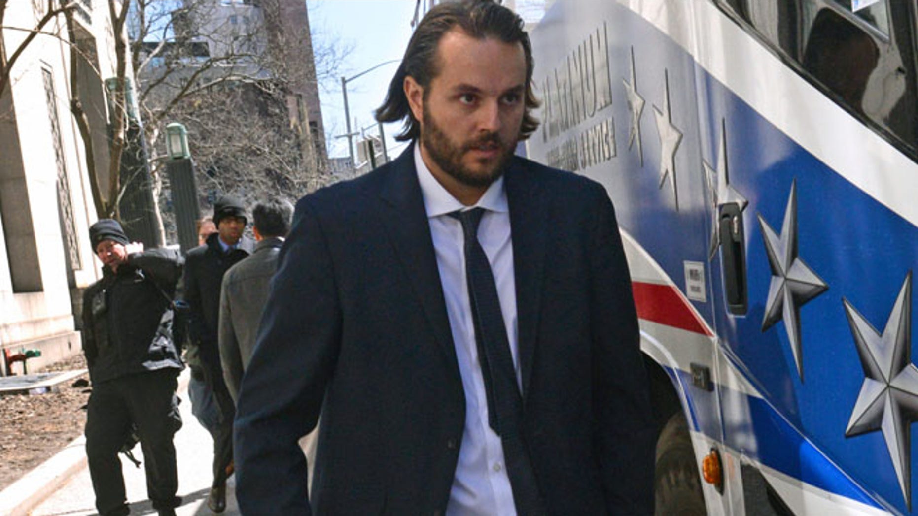 FILE- In this April 3, 2013 file photo, former Goldman Sachs trader Matthew Taylor leaves Manhattan federal court in New York. Taylor was sentenced to nine months in prison for wire fraud on Friday, Dec. 6, 2013, by a Manhattan judge. Earlier in 2013, Taylor had plead guilty to concealing an unauthorized $8.3 billion trading position in 2007. He admitted his wrongdoing to Goldman within 36 hours, but escaped criminal charges until this year. (AP Photo/Louis Lanzano, File)