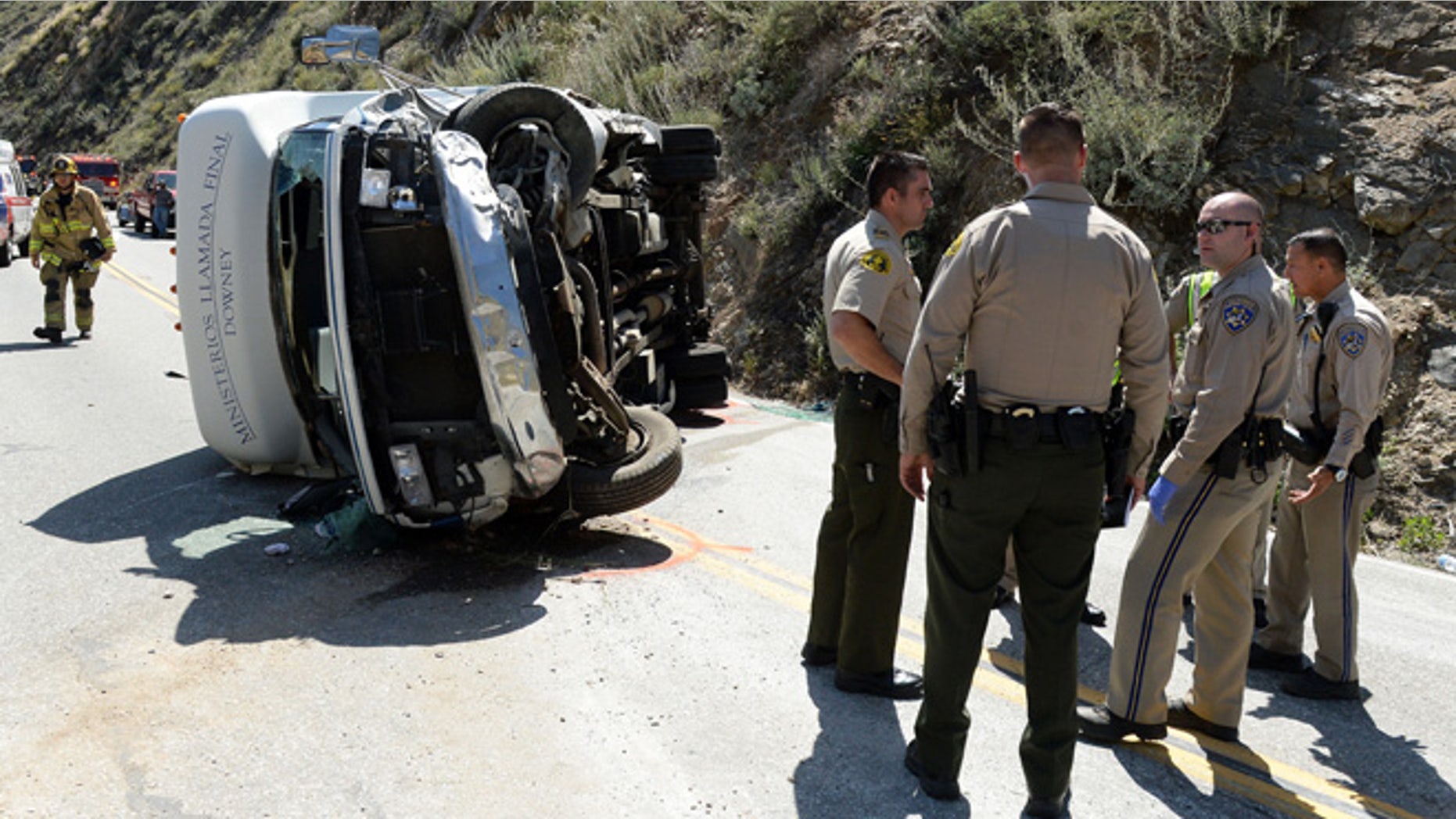 People were injured after a small tour bus crashed and rolled over on highway 330 approximately 2 miles north of the 210 freeway Sunday, May 22, 2016. Both directions of the 330 are currently closed. Cause of the crash is under investigation. (Will Lester /The Inland Valley Daily Bulletin via AP) MANDATORY CREDIT