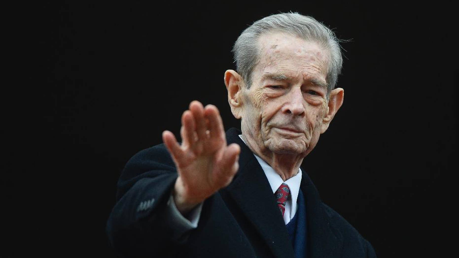 Romania's former King Michael I waves to supporters during an appearance at the Elisabeta Palace in Bucharest, Romania, Wednesday, Nov. 19, 2014. Former monarch King Michael, 93, the only surviving leader from World War II, invited President-elect Klaus Iohannis to lunch Wednesday at his Elizabeth Palace.(AP Photo/Octav Ganea, Mediafax) ROMANIA OUT