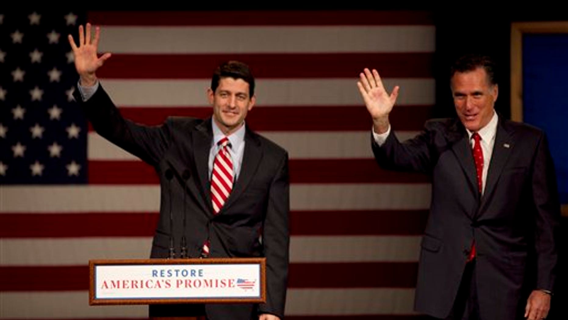 March 30: U.S. Rep. Paul Ryan, R-Wis., Chairman of the House Budget Committee, left, and GOP presidential candidate, former Massachusetts Gov. Mitt Romney wave to the audience as Romney takes the stage during a campaign stop on the campus of Lawrence University, in Appleton, Wis.
