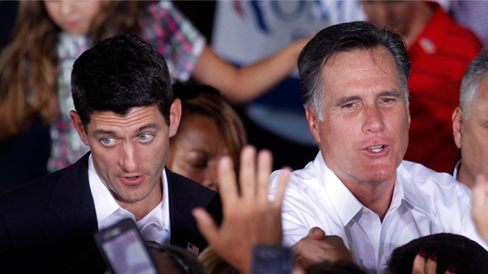 Aug. 11, 2012: Republican presidential candidate, former Massachusetts Gov. Mitt Romney, right, and his newly announced vice presidential running mate, Rep. Paul Ryan, R-Wis., left, greet supporters during a campaign rally in Manassas, Va.