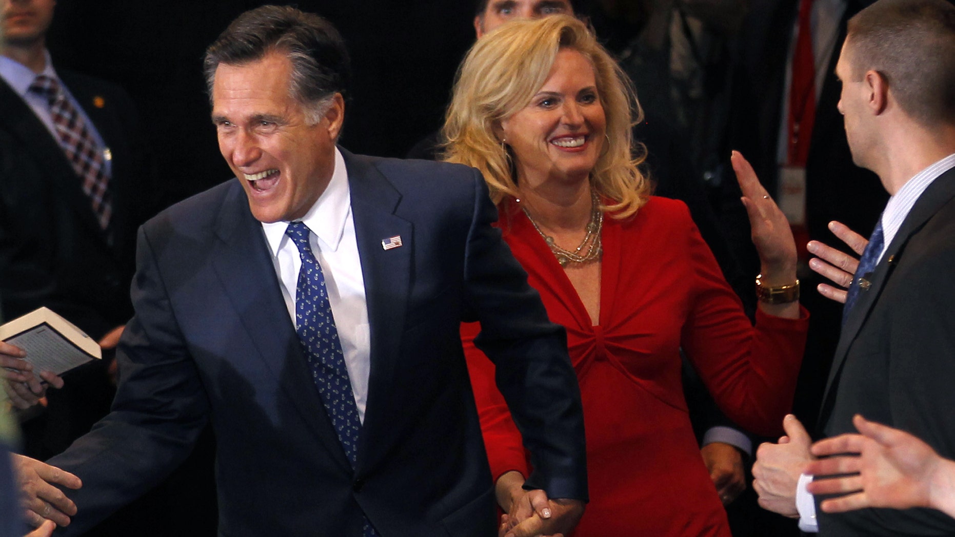 Republican presidential candidate former Massachusetts Gov. Mitt Romney arrives with his wife Ann at his election watch party after winning the Michigan primary in Novi, Mich., Tuesday, Feb. 28, 2012. (AP Photo/Gerald Herbert)