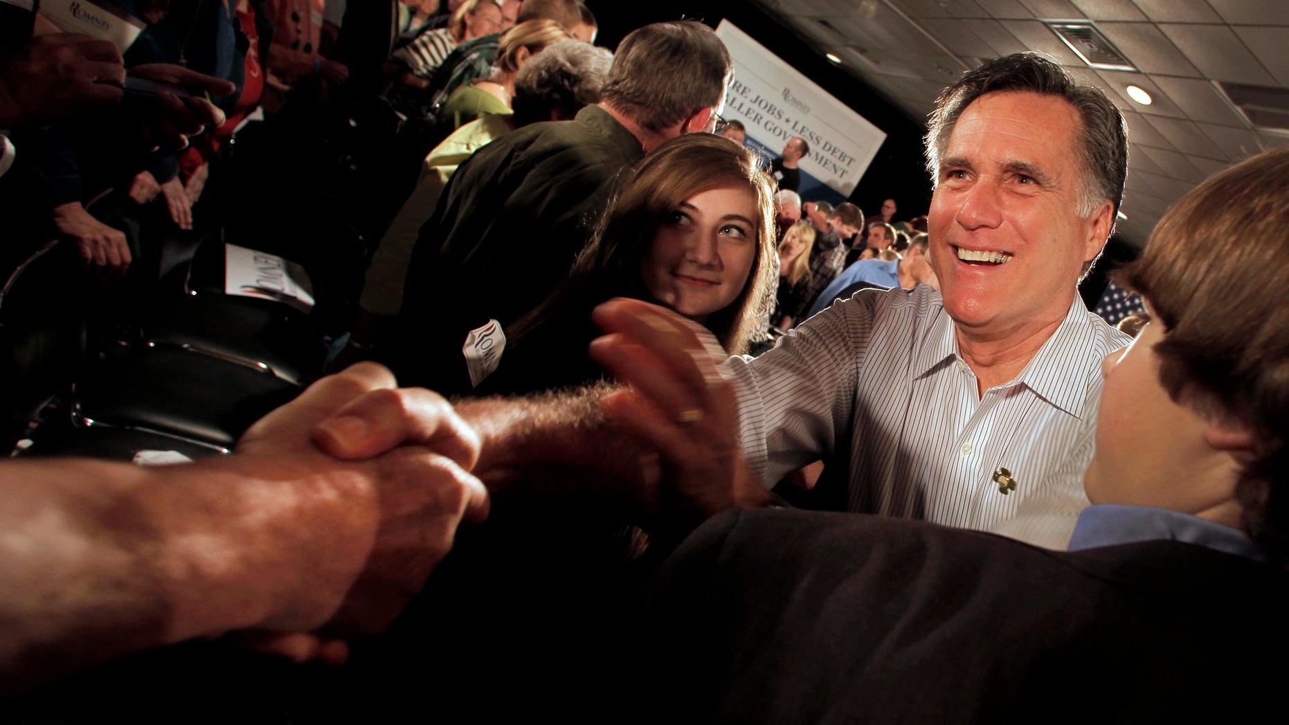 Republican presidential candidate, former Massachusetts Gov. Mitt Romney greets the crowd during a campaign stop Saturday, March 17, 2012, in Collinsville, Ill. (AP Photo/Charlie Riedel)