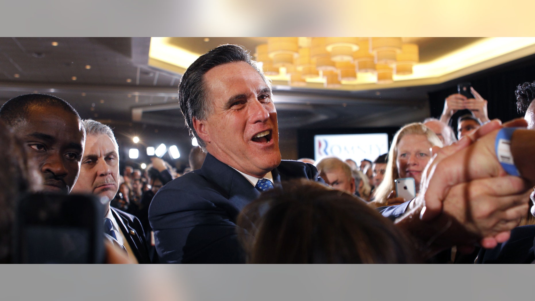 Republican presidential candidate, former Massachusetts Gov. Mitt Romney, greets supporters at his election night party in Boston, Tuesday, March 6, 2012. (AP Photo/Gerald Herbert)