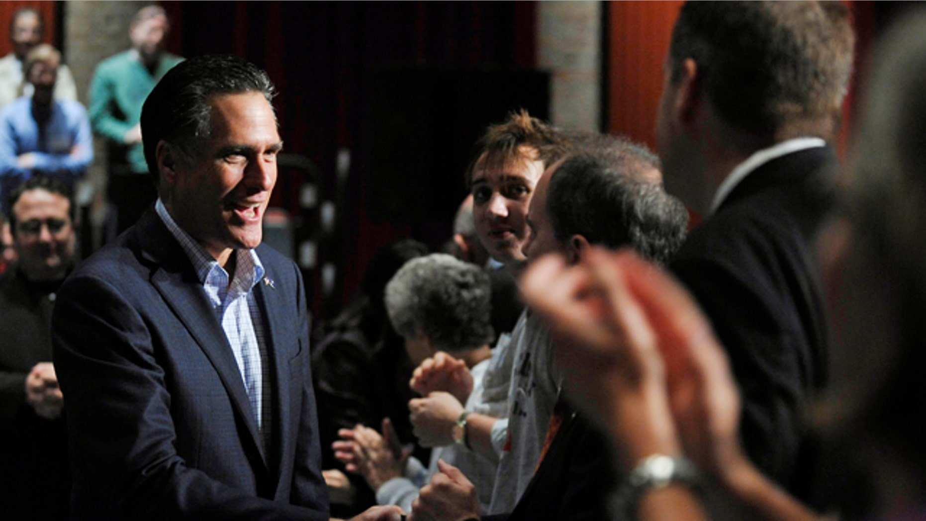 Dec. 17, 2011: Republican presidential candidate and former Massachusetts Gov. Mitt Romney greets supporters during a town hall meeting at Memminger Auditorium in Charleston, S.C.