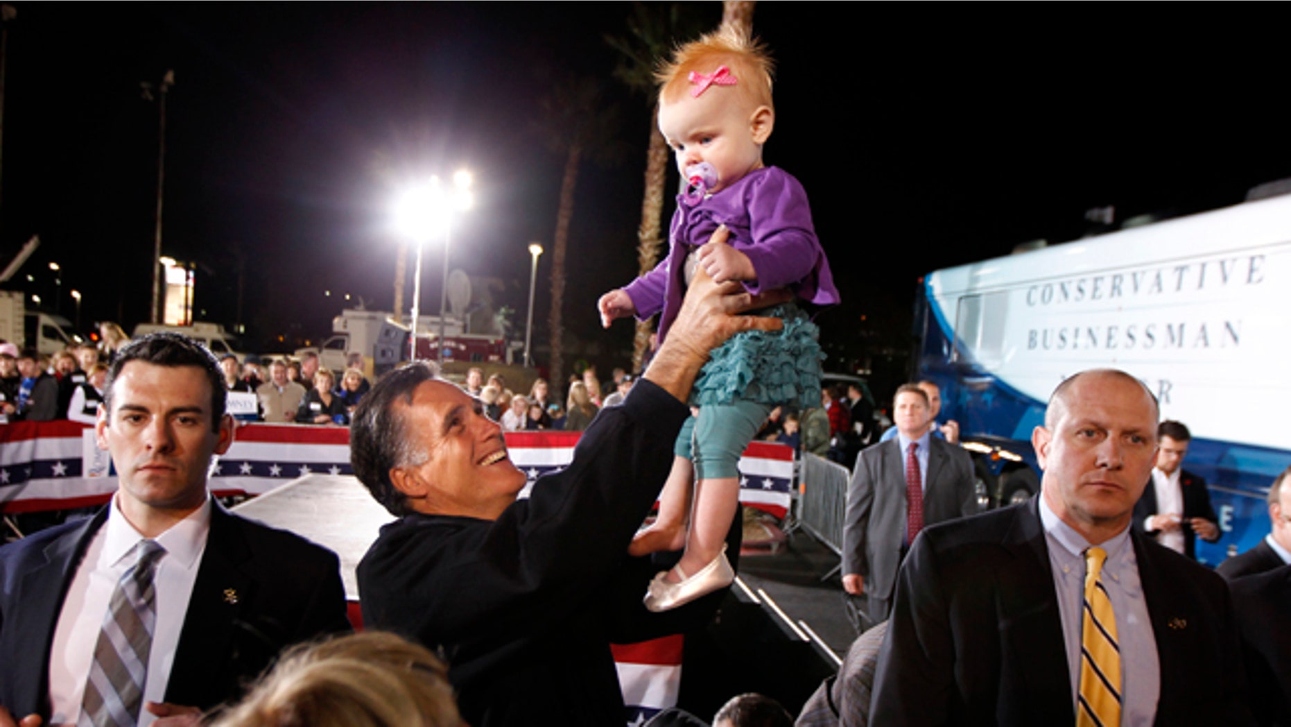Feb. 3: Mitt Romney holds up 9-month-old Eve Smith, of Las Vegas, at a campaign rally in Henderson, Nev.