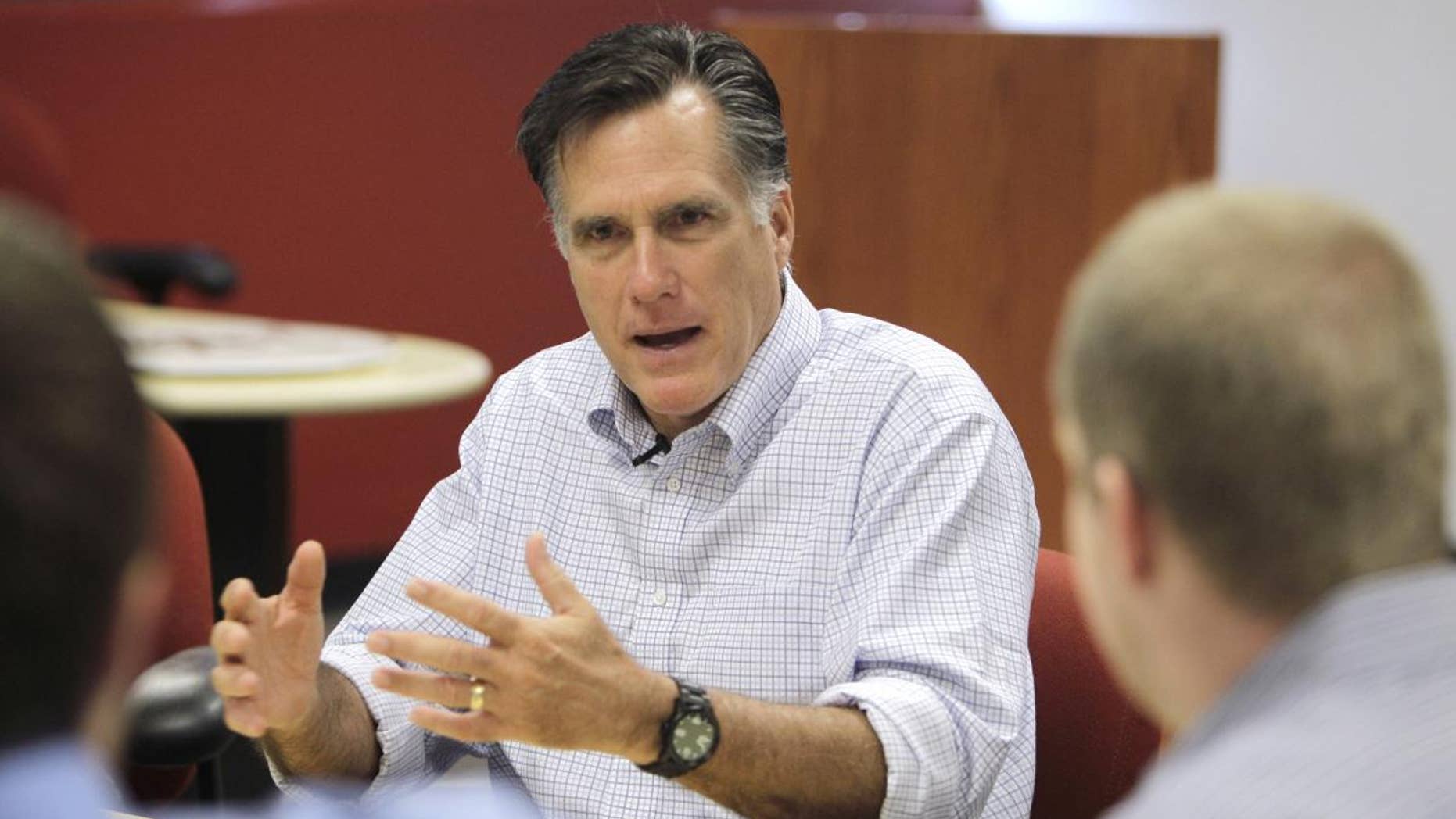 Republican presidential hopeful, former Massachusetts Gov. Mitt Romney meets with entrepreneurs at Bizdom U in Detroit, Thursday, June 9, 2011. Bizdom U is a business development center to help entrepreneurs start up businesses in the state. (AP Photo/Carlos Osorio)