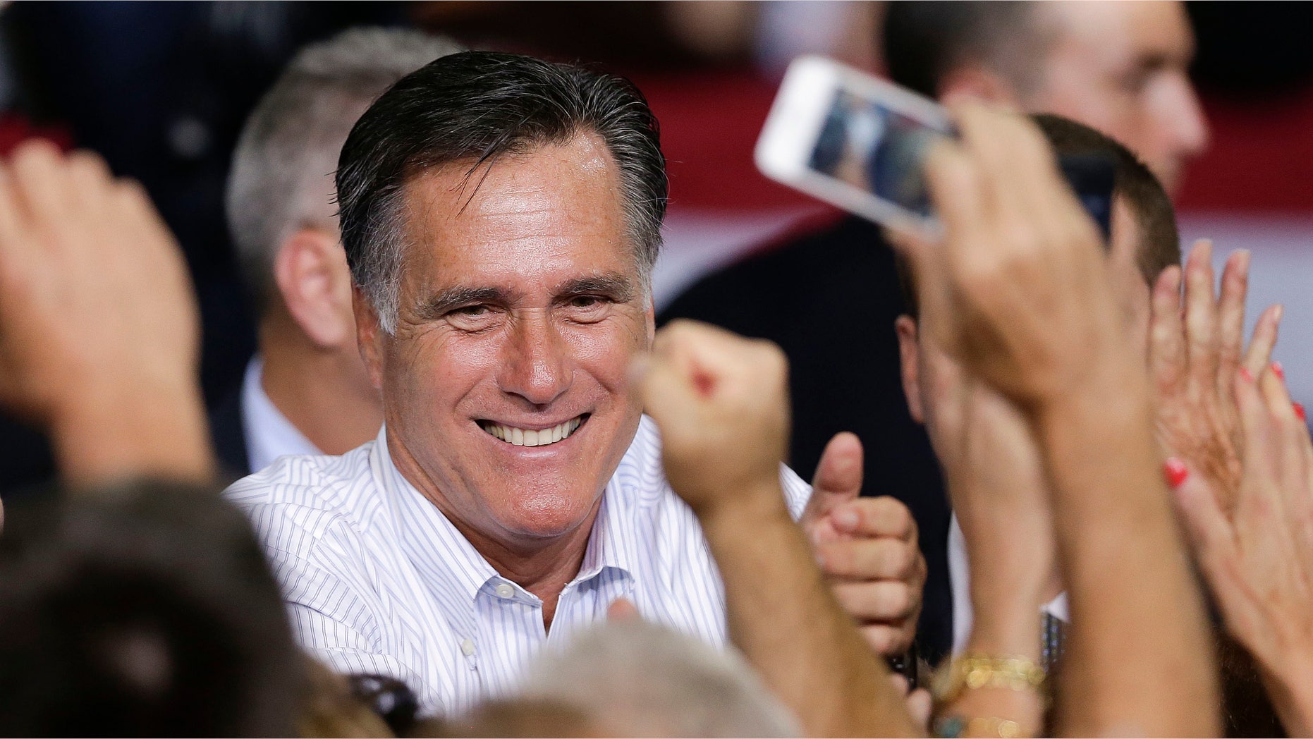 FILE: Sept. 21, 2012: Mitt Romney greets supporters after speaking at a rally Friday in Las Vegas.