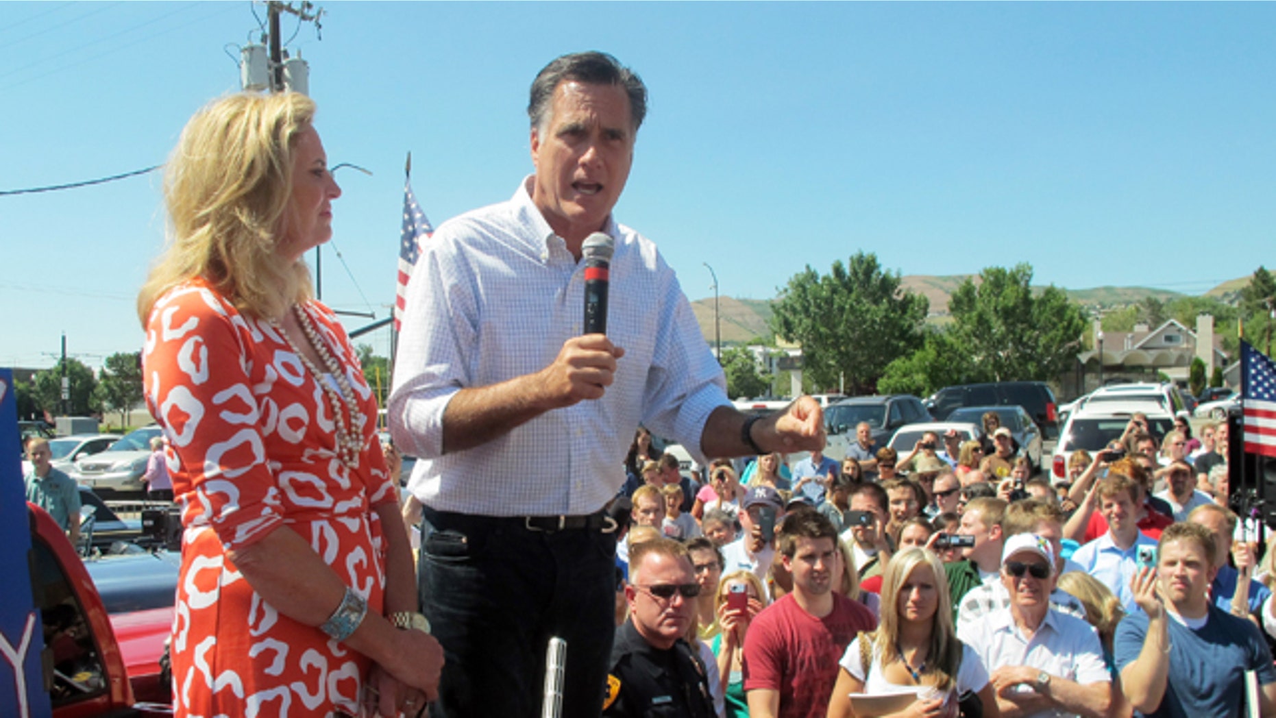 June 24: Former Massachusetts Gov. Mitt Romney and his wife, Ann, greet supporters at a drive-in hamburger restaurant in Salt Lake City.