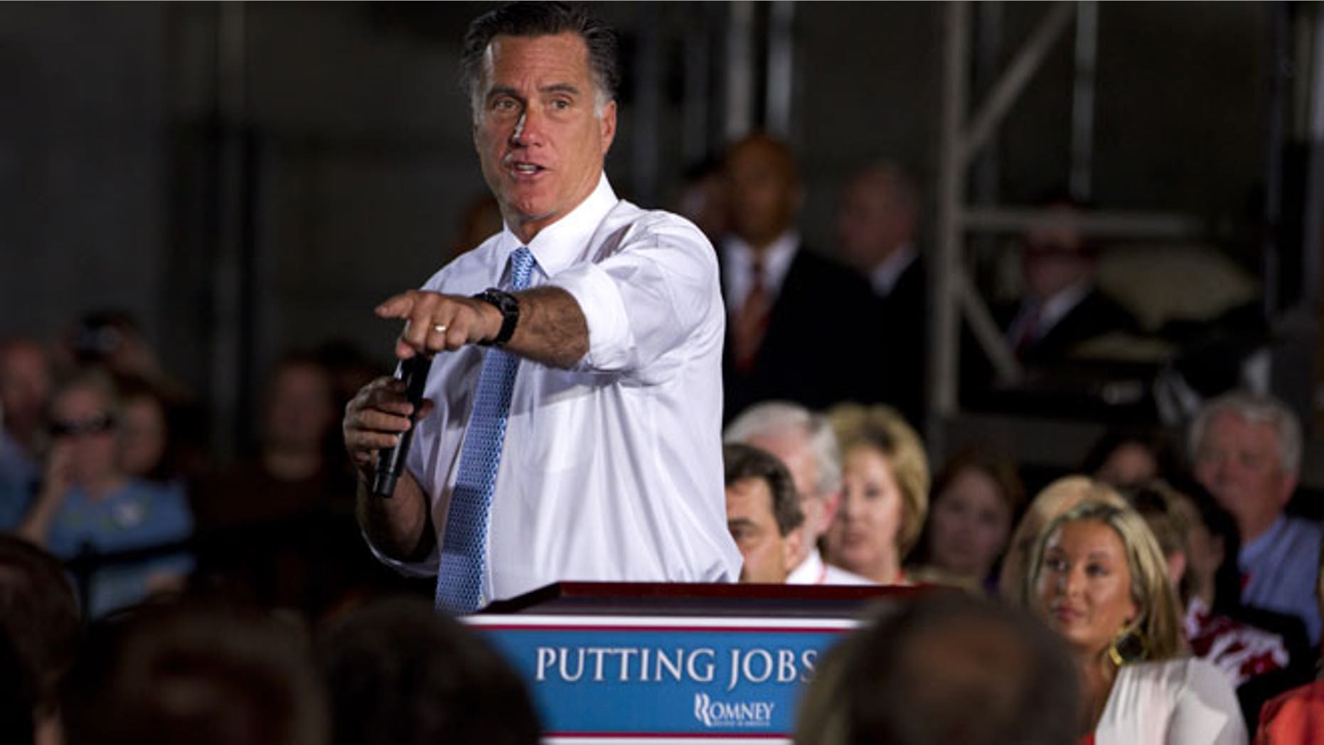 June 5, 2012: Republican presidential candidate, former Massachusetts Gov. Mitt Romney gestures during a campaign stop at Southwest Office Systems, in Fort Worth, Texas.