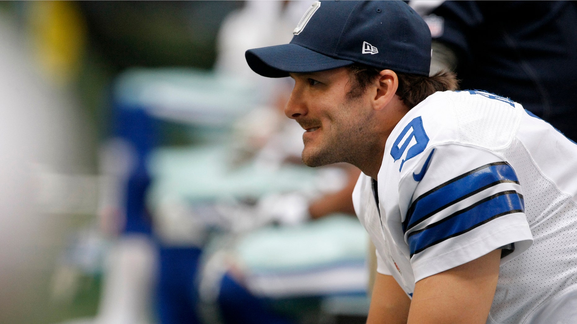 Dallas Cowboys' Tony Romo (9) sits on the bench during an offensive series by the Cleveland Browns in the first half of an NFL football game on Sunday, Nov. 18, 2012, in Arlington, Texas. (AP Photo/Brandon Wade)
