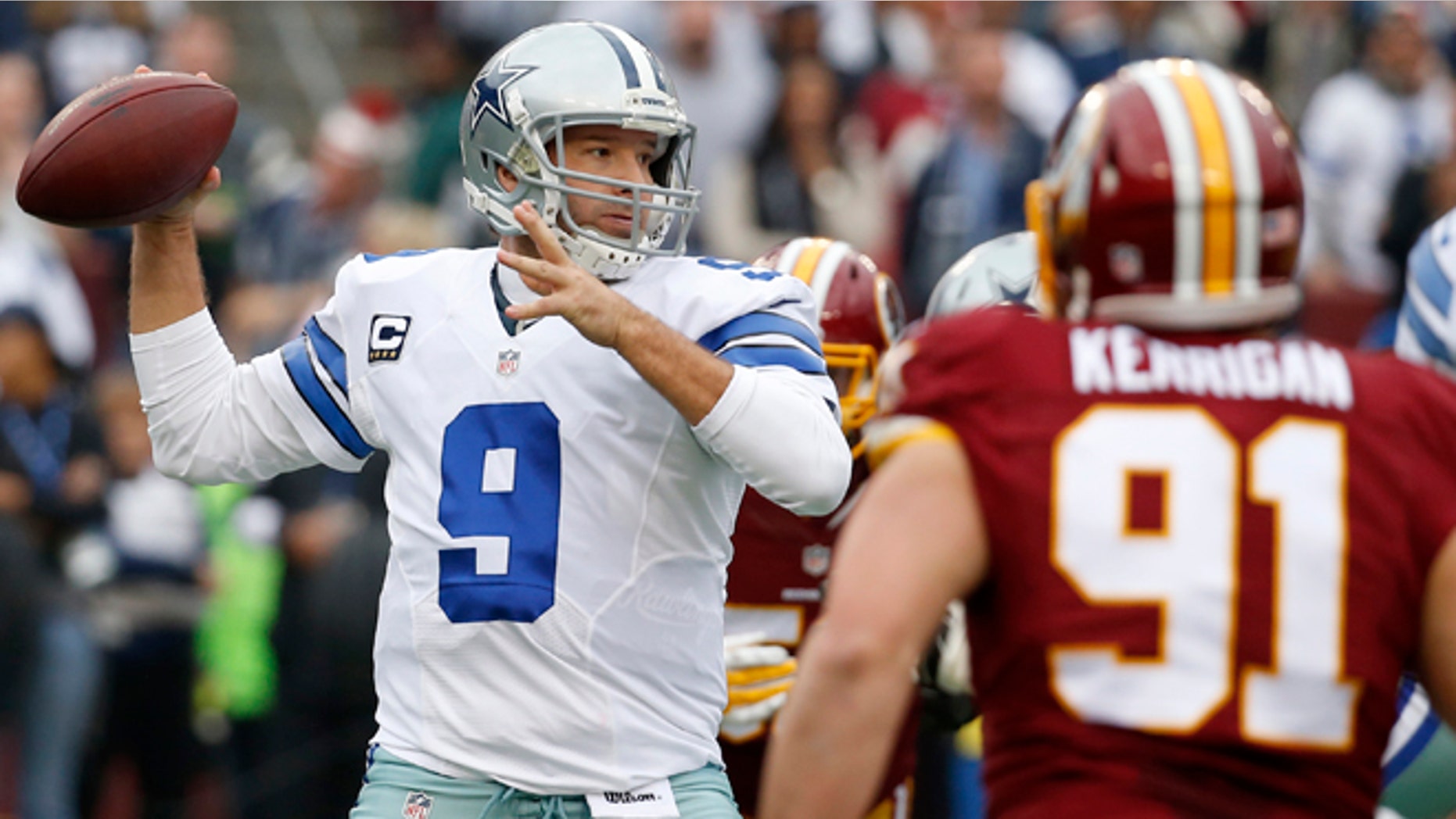 Dallas Cowboys quarterback Tony Romo (9) passes the ball during the first half of an NFL football game against the Washington Redskins in Landover, Md., Sunday, Dec. 28, 2014. (AP Photo/Alex Brandon)