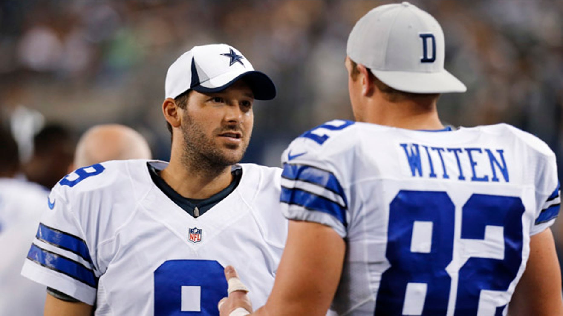 FILE - In this Saturday, Aug. 24, 2013 file photo, Dallas Cowboys quarterback Tony Romo (9) and tight end Jason Witten (82) talk on the sideline during the second half of a preseason NFL football game against the Cincinnati Bengals,in Arlington, Texas. Quarterback Tony Romo is hurt again, and his favorite tight end is here to tell you the Cowboys can make it work without him, Tuesday, Aug. 30, 2016. (AP Photo/Sharon Ellman, File)