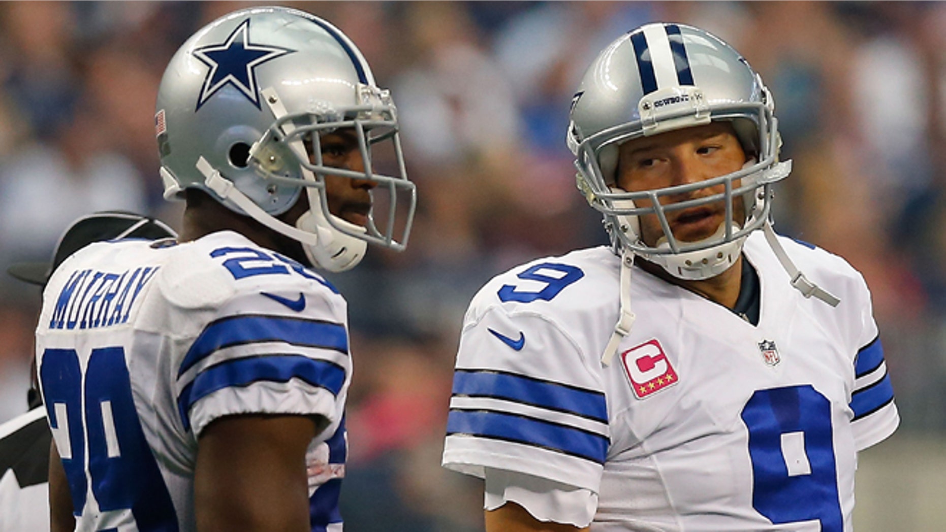 ARLINGTON, TX - OCTOBER 05: Tony Romo #9 of the Dallas Cowboys talks to DeMarco Murray #29 of the Dallas Cowboys against the Houston Texans in the first half at AT&T Stadium on October 5, 2014 in Arlington, Texas. (Photo by Tom Pennington/Getty Images)