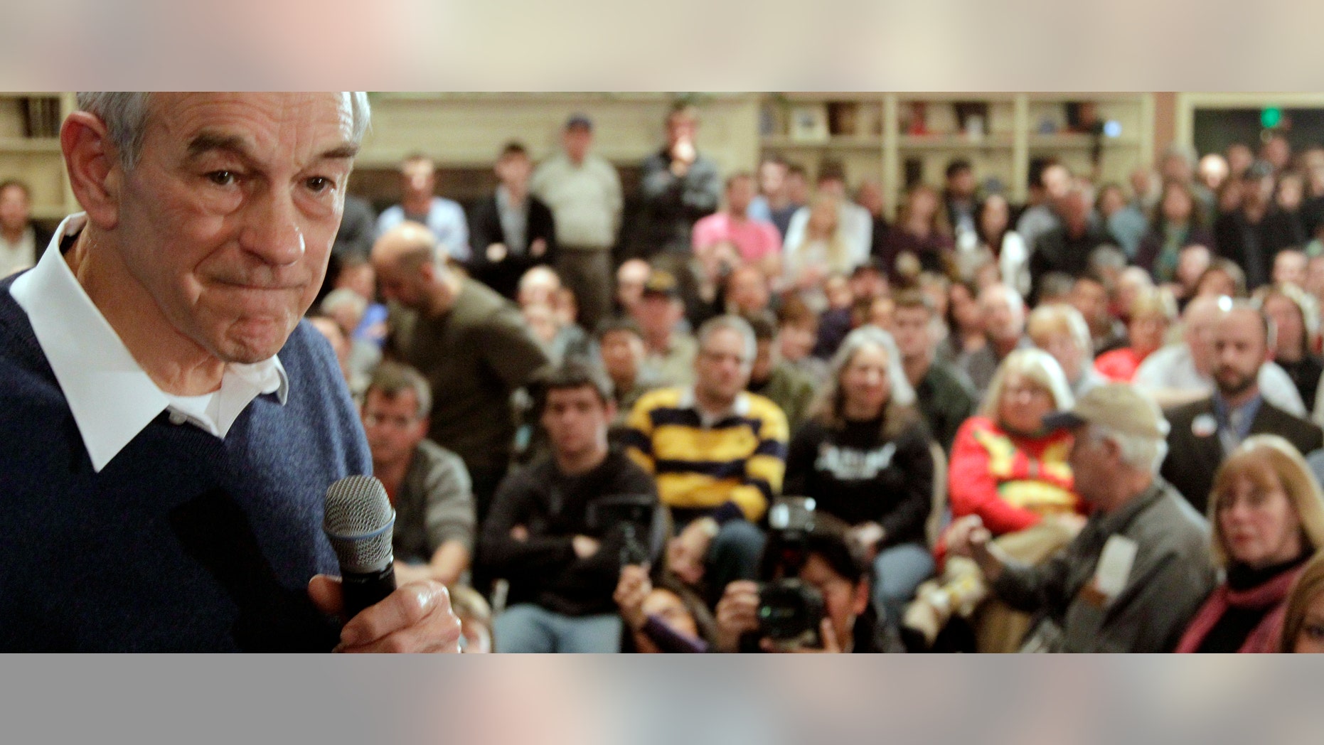 Republican presidential candidate, Rep. Ron Paul, R-Texas, listens to a question during a town hall style meeting in Meredith, N.H., Sunday, Jan. 8, 2012. (AP Photo/Stephan Savoia)