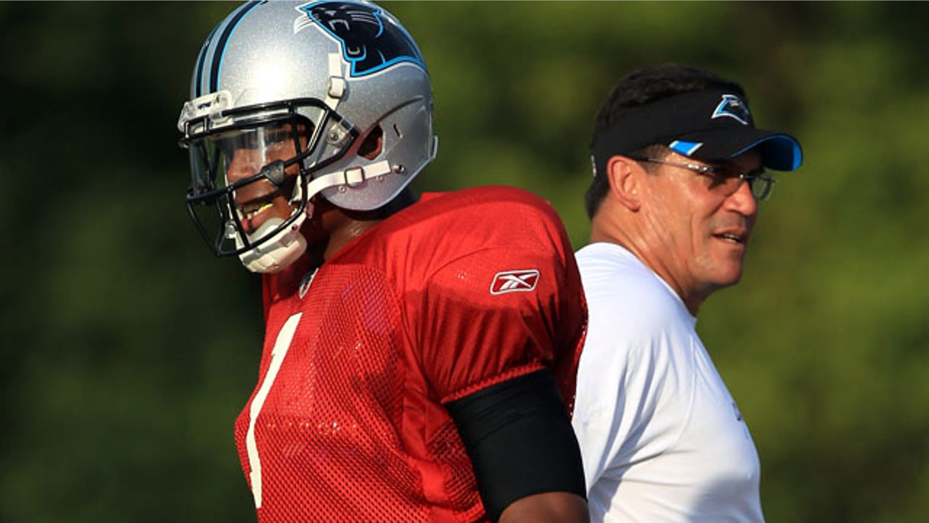 SPARTANBURG, SC - AUGUST 03: Cam Newton #1 of the Carolina Panthers stands next to head coach Ron Rivera during training camp at Wofford College on August 3, 2011 in Spartanburg, South Carolina. (Photo by Streeter Lecka/Getty Images)