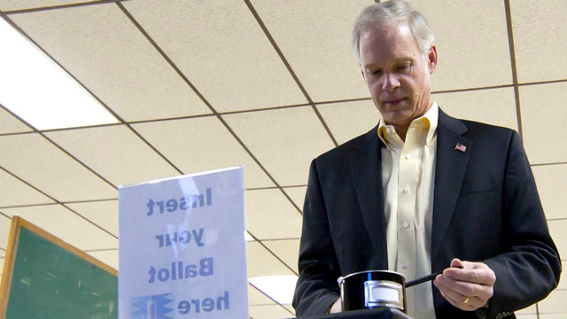 FILE: Wisconsin Republican Sen. Ron Johnson casts a ballot in Oshkosh, Wis.