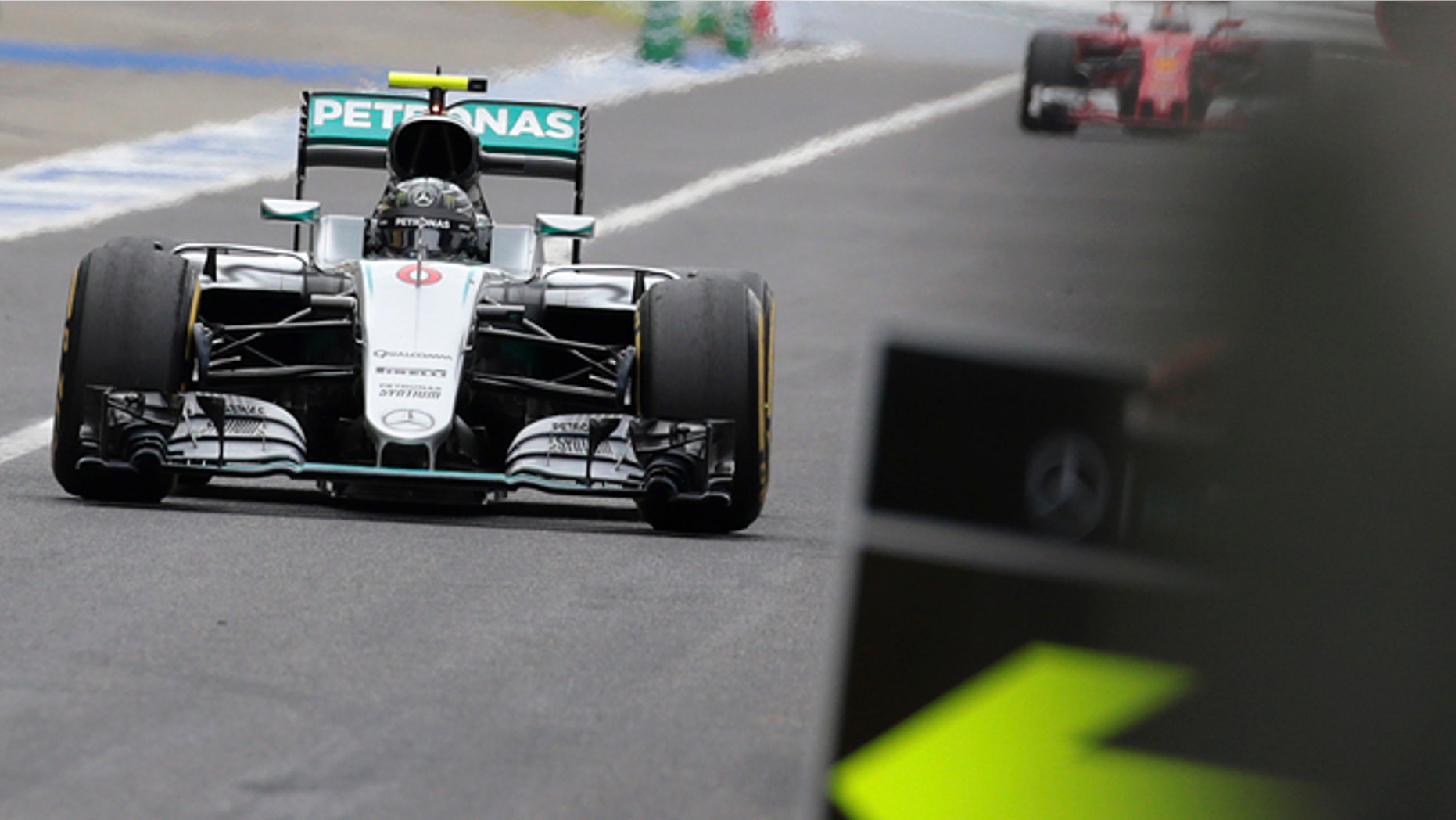 Mercedes driver Nico Rosberg of Germany returns to the pit lane on the way to winning the Japanese Formula One Grand Prix at the Suzuka International Circuit in Suzuka, central Japan, Sunday, Oct. 9, 2016. (Yuya Shino/Pool Photo via AP)
