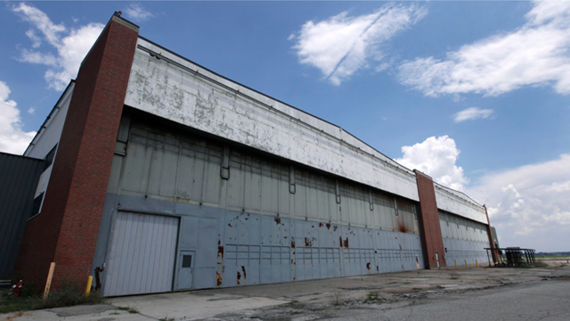 July 17, 2013: Part of the former Willow Run Bomber Plant stands in Ypsilanti Township, Mich. A group wants to preserve a portion of the plant and house a museum there dedicated to aviation and the countless Rosies across the country. Save the Bomber Plant officials have until May 1, to raise the remainder of the $8 million needed to save the plant from demolition. (AP Photo/Paul Sancya, File)