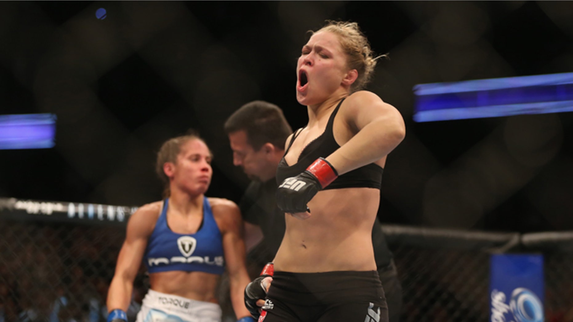 ANAHEIM, CA - FEBRUARY 23: Ronda Rousey celebrates her UFC Bantamweight Title over Liz Carmouche at Honda Center on February 23, 2013 in Anaheim, California. (Photo by Jeff Gross/Getty Images)