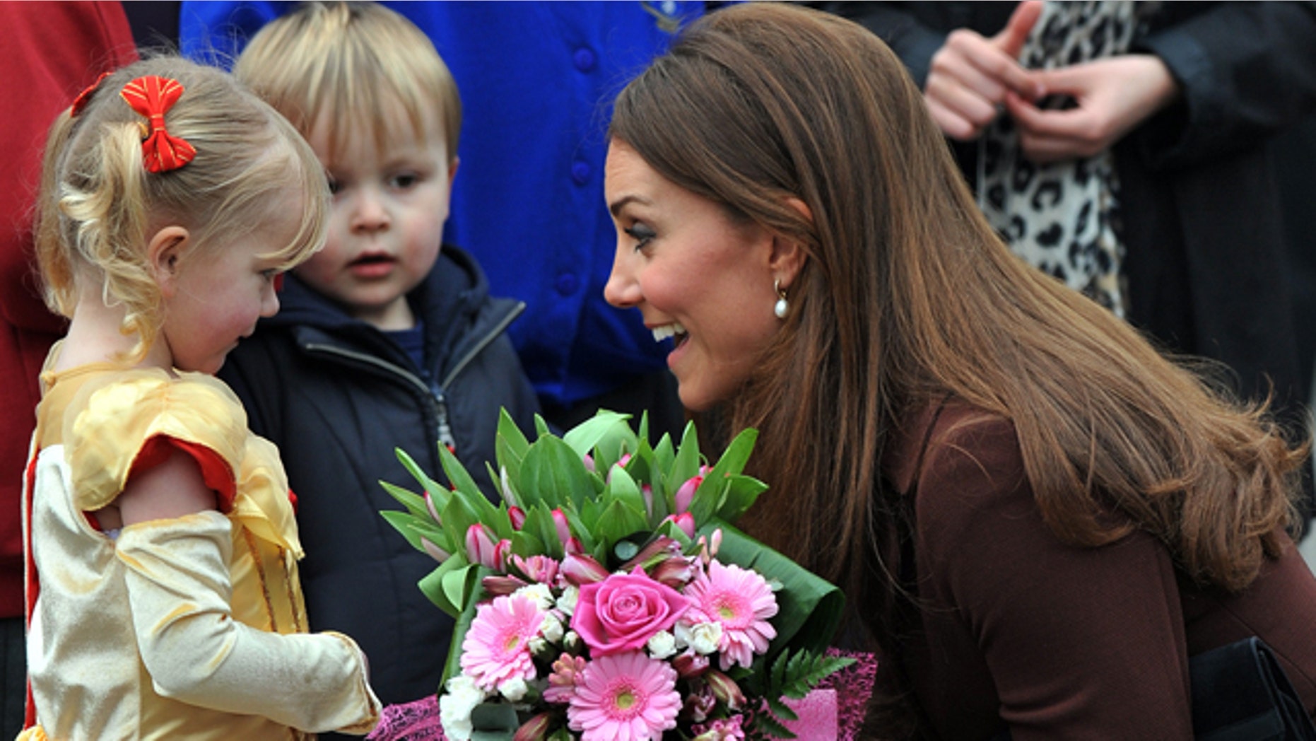 Mar. 5, 2013: Britain's Catherine, Duchess of Cambridge receives flowers from 3-year old Isobelle Laursen, left, during her visit to Humberside Fire and Rescue Station.